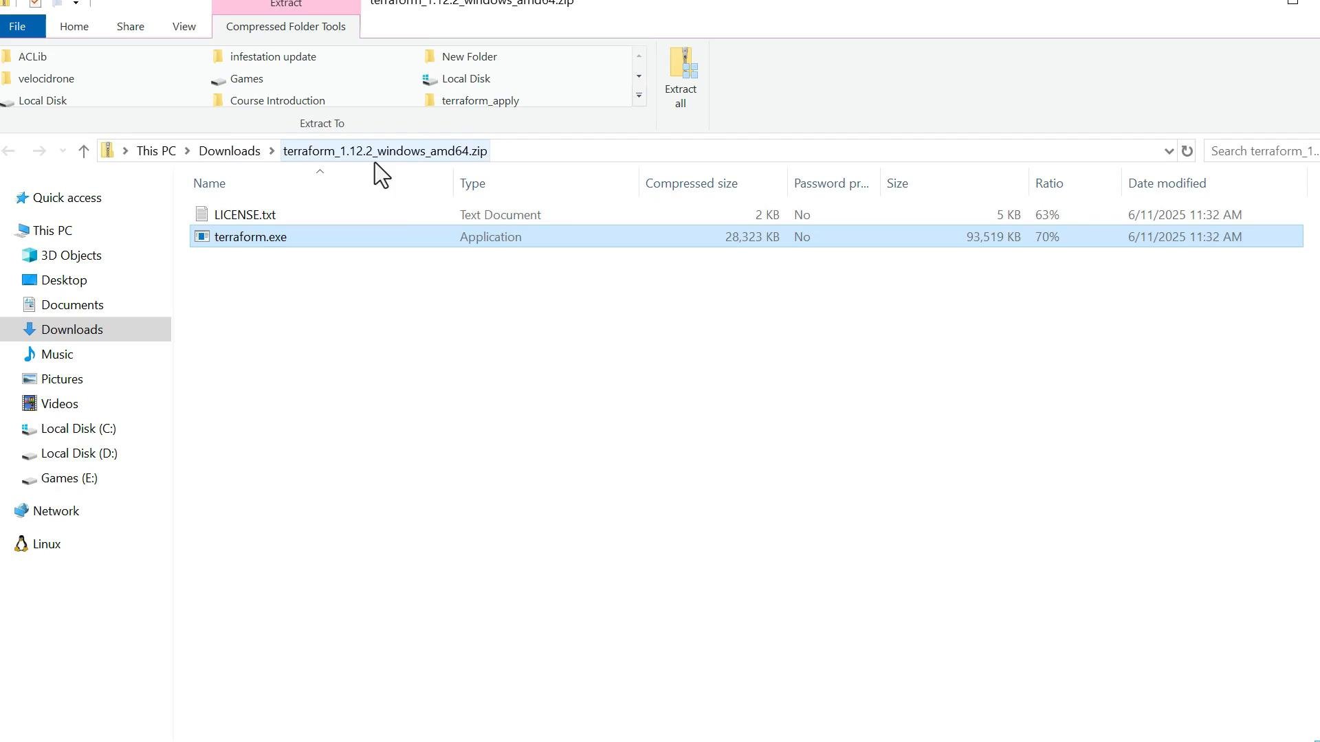 A Windows File Explorer window showing the contents of a downloaded zip file (terraform_1.12.2_windows_amd64.zip) with LICENSE.txt and terraform.exe listed, the terraform.exe entry highlighted. The left pane shows the Downloads folder selected.