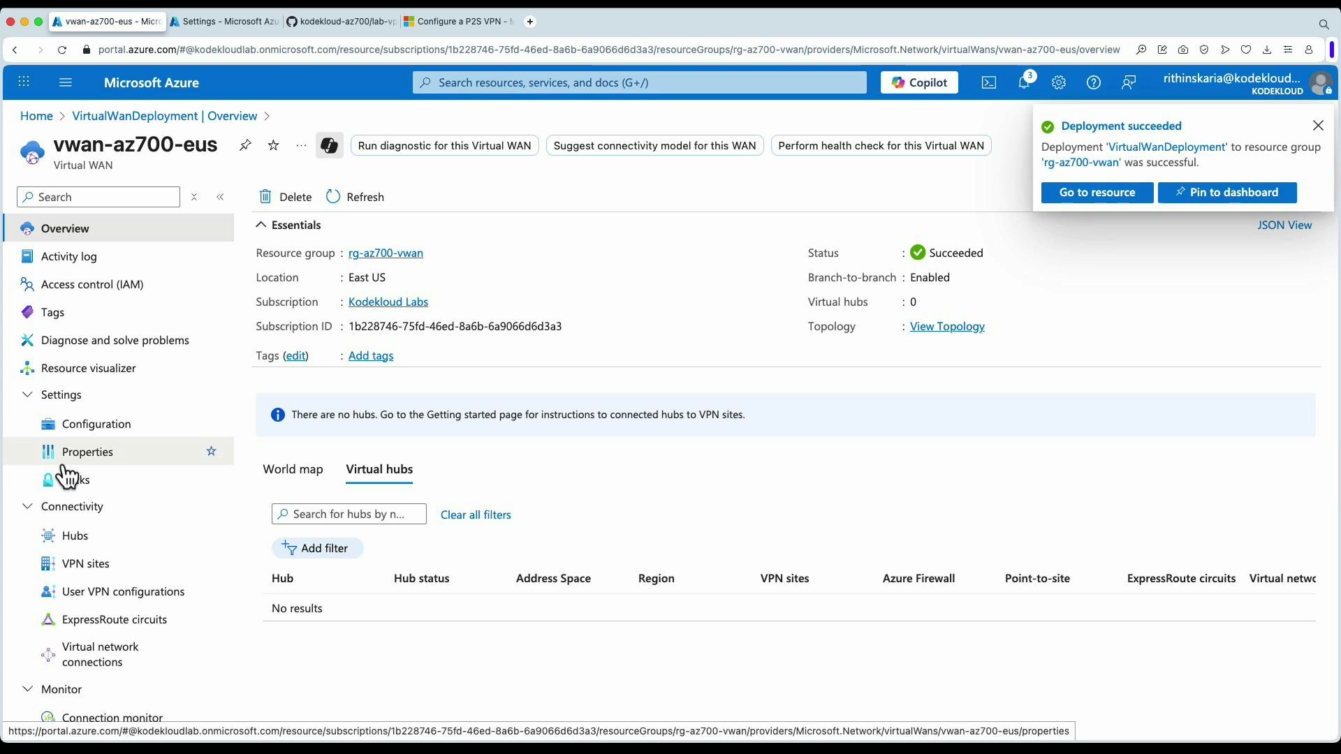 A screenshot of the Microsoft Azure portal showing the "vwan-az700-eus" Virtual WAN overview with essentials (resource group, location, status = Succeeded) and a "Deployment succeeded" notification. The Virtual hubs section is empty and shows "No results."