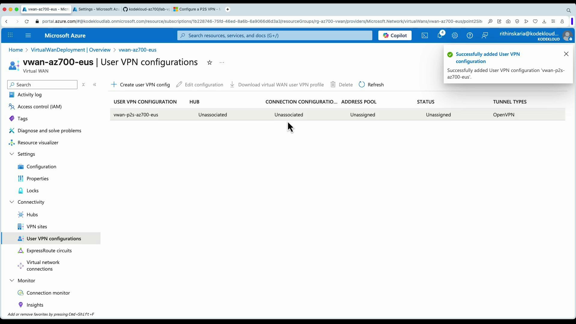 A screenshot of the Microsoft Azure portal showing the "vwan-az700-eus | User VPN configurations" page. It lists a user VPN config (vwan-p2s-az700-eus) with status "Unassigned" and an on-screen notification saying the User VPN configuration was successfully added.