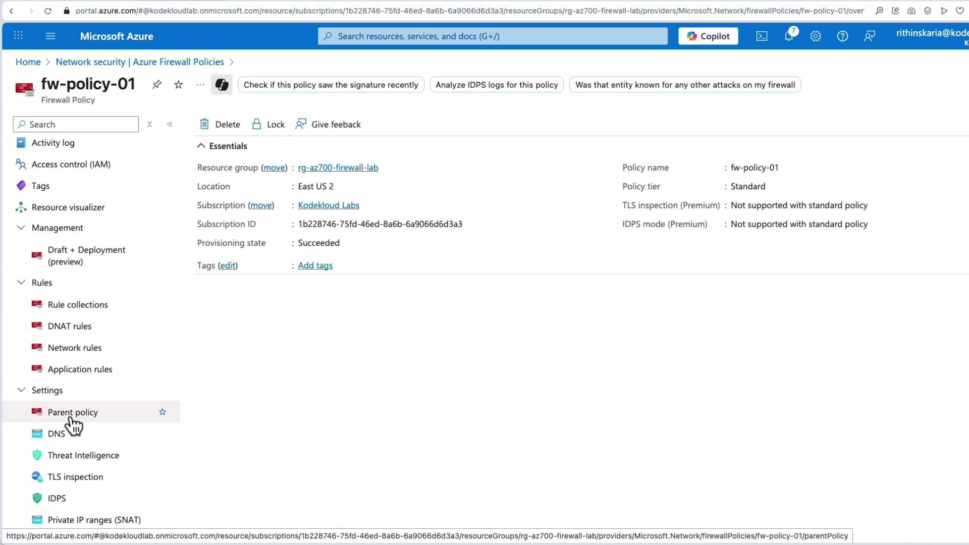 A screenshot of the Microsoft Azure portal displaying an Azure Firewall Policy page for "fw-policy-01," showing essentials like resource group, location, subscription ID, and provisioning state. The left-hand navigation lists Activity log, Rules (DNAT/Network/Application), and Settings with "Parent policy" highlighted.