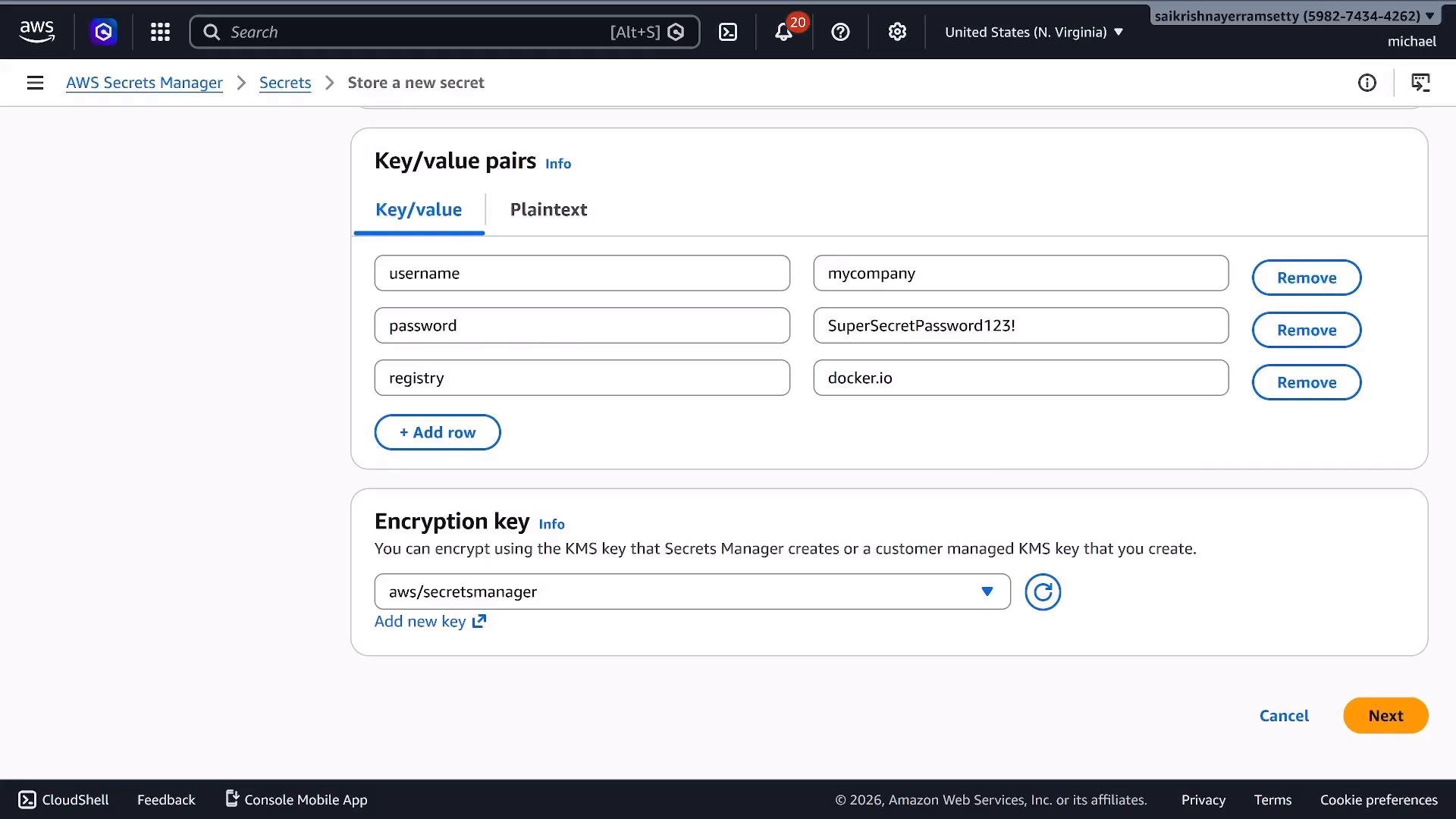 A screenshot of the AWS Secrets Manager "Store a new secret" screen showing key/value pairs for username (mycompany), password (SuperSecretPassword123!), and registry (docker.io). The page also shows an encryption key selection and Next/Cancel buttons.