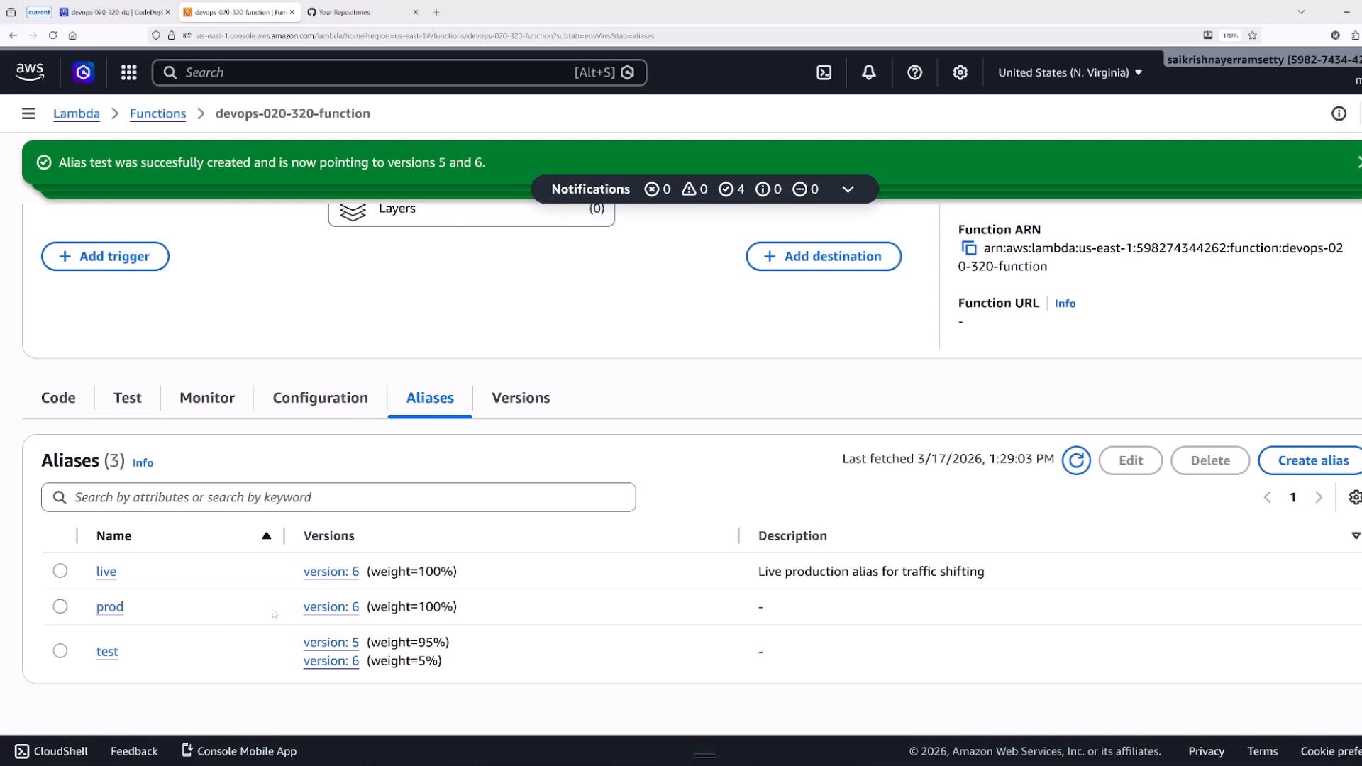 Screenshot of the AWS Lambda console on the "Aliases" tab for the function devops-020-320-function, with a green banner stating "Alias test was successfully created and is now pointing to versions 5 and 6." The aliases table lists "live", "prod", and "test" entries (with version numbers and traffic weights) and the function ARN is visible on the right.