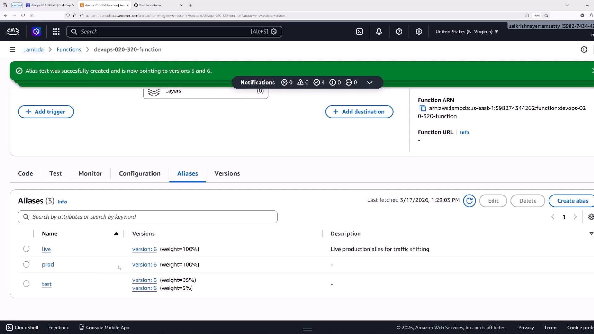 Screenshot of the AWS Lambda console on the "Aliases" tab for the function devops-020-320-function, with a green banner stating "Alias test was successfully created and is now pointing to versions 5 and 6." The aliases table lists "live", "prod", and "test" entries (with version numbers and traffic weights) and the function ARN is visible on the right.