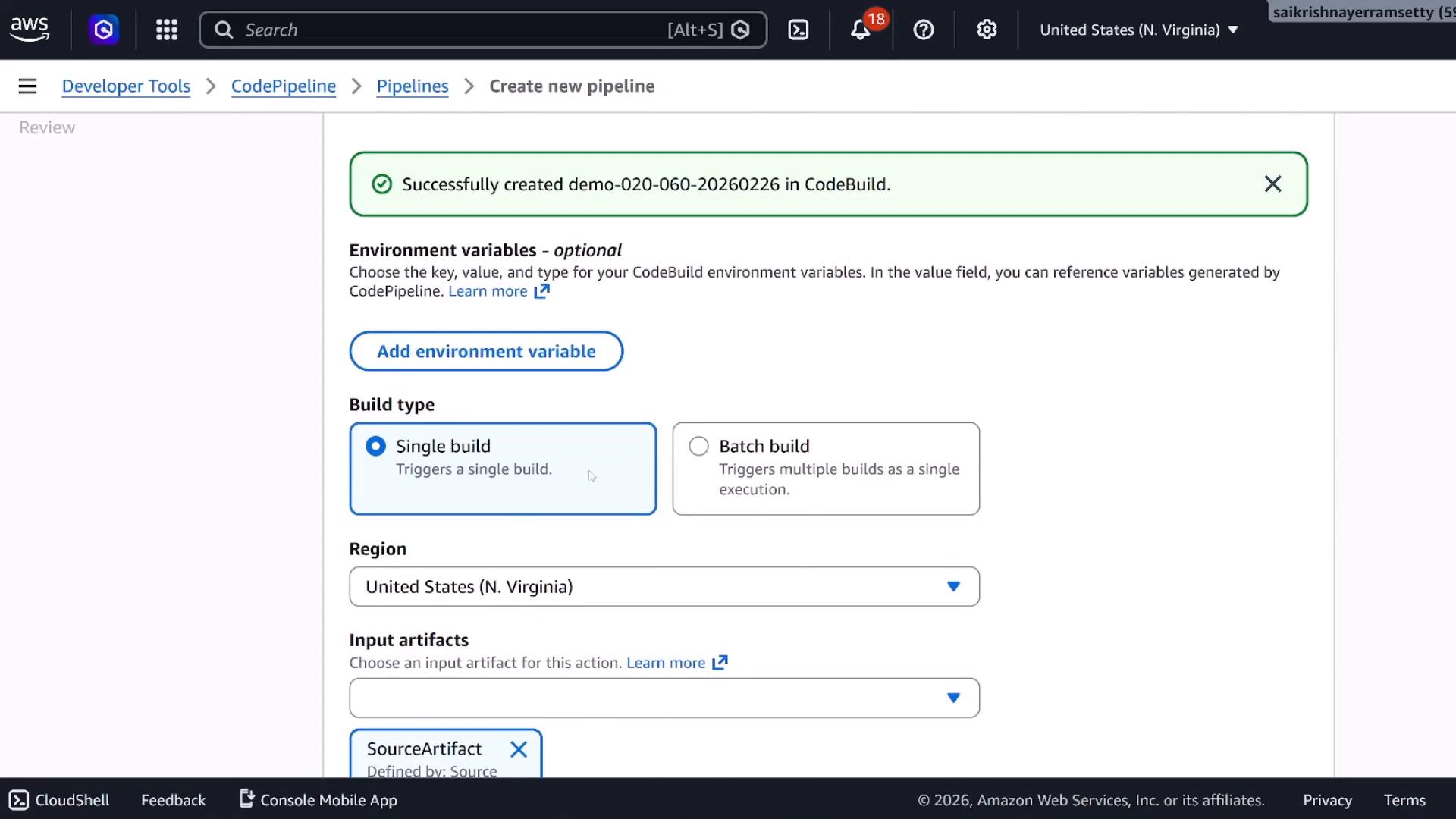 Screenshot of the AWS CodePipeline "Create new pipeline" page showing a green success banner that a CodeBuild project was created. The page displays settings for environment variables, build type (Single build selected), region, and input artifacts.