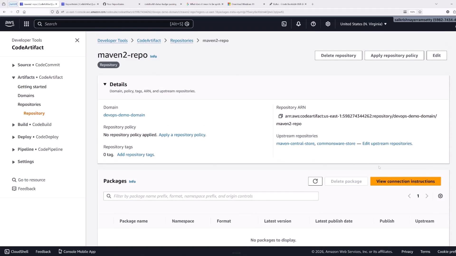 A screenshot of the AWS CodeArtifact console showing the "maven2-repo" repository details, including domain, repository ARN, and upstream repositories. The packages section is visible but shows "No packages to display."