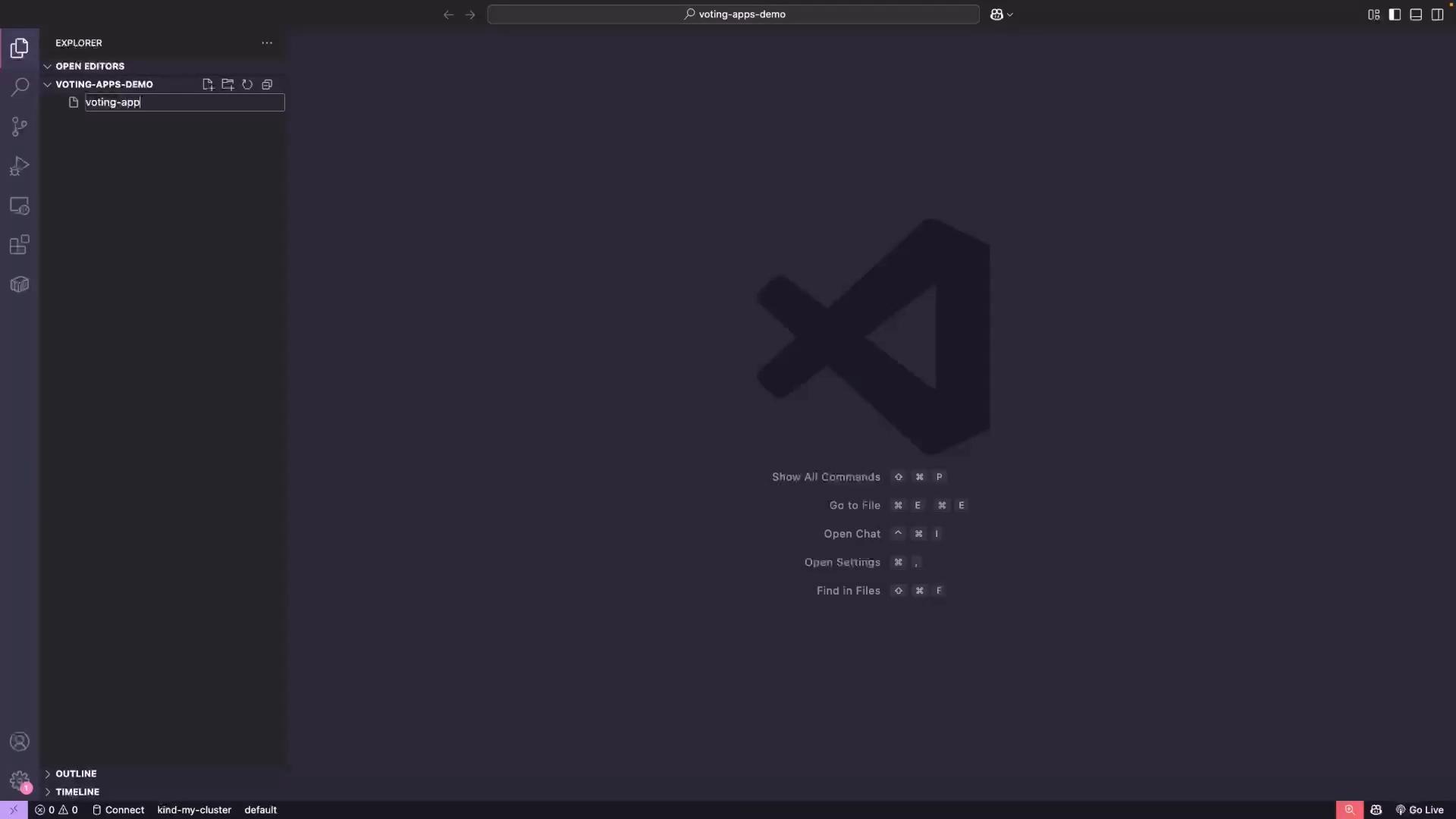 A dark-themed Visual Studio Code window with the Explorer sidebar open showing a folder named "voting-apps-demo" and a file being created called "voting-app". The main area shows the large VS Code logo and quick command hints in the center.