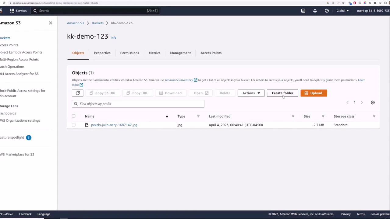 A screenshot of the Amazon S3 web console showing the bucket "kk-demo-123" with one listed JPG file (pexels-julio-nery-1687147.jpg). The interface shows options like Create folder, Upload, and object details (size, last modified).