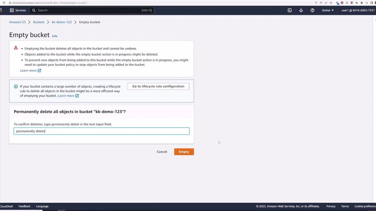 A screenshot of the Amazon S3 console showing the "Empty bucket" confirmation for bucket "kk-demo-123," including warnings and instructions to type "permanently delete." The text field contains "permanently delete" and there are Cancel and orange "Empty" buttons at the bottom.
