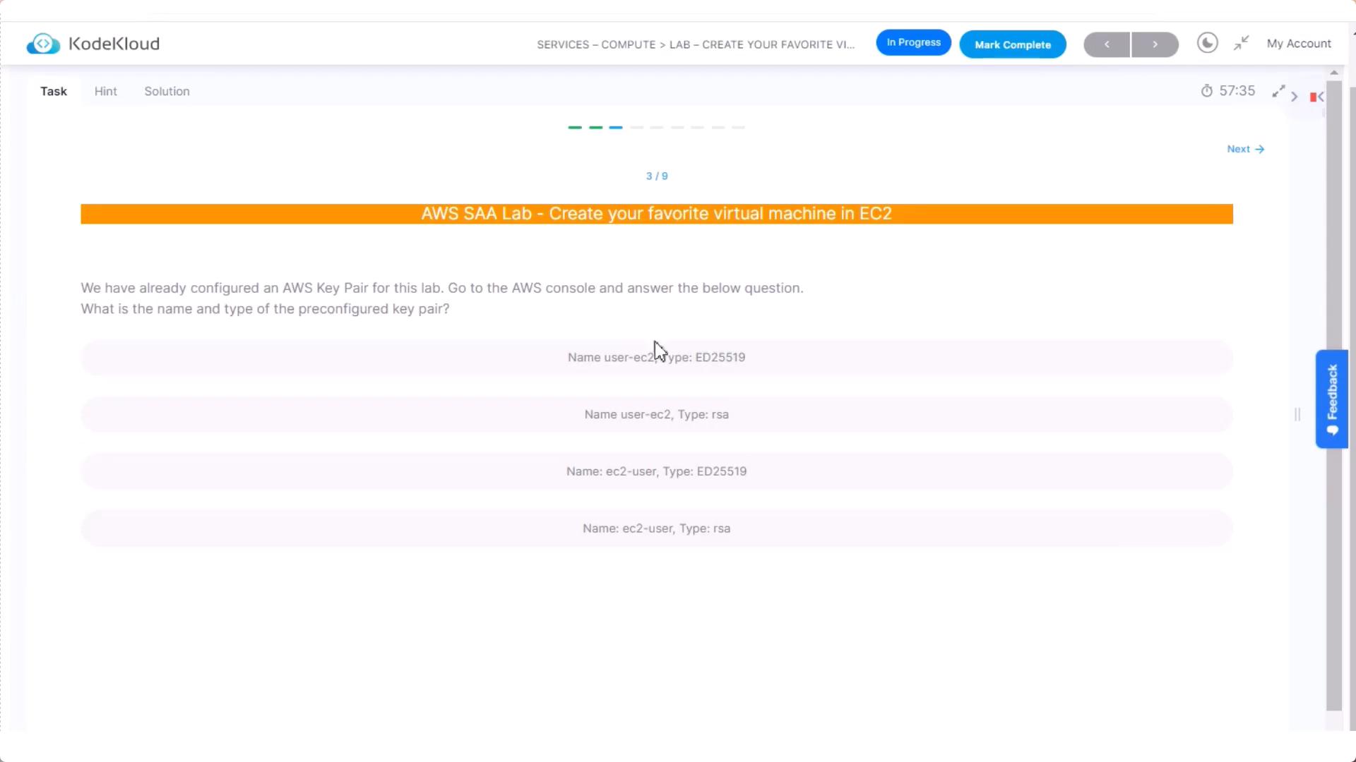 A KodeKloud lab webpage for an "AWS SAA Lab - Create your favorite virtual machine in EC2" showing a question about the name and type of a preconfigured AWS key pair with several multiple-choice answers. The page also shows a progress bar, navigation controls, and a feedback button.