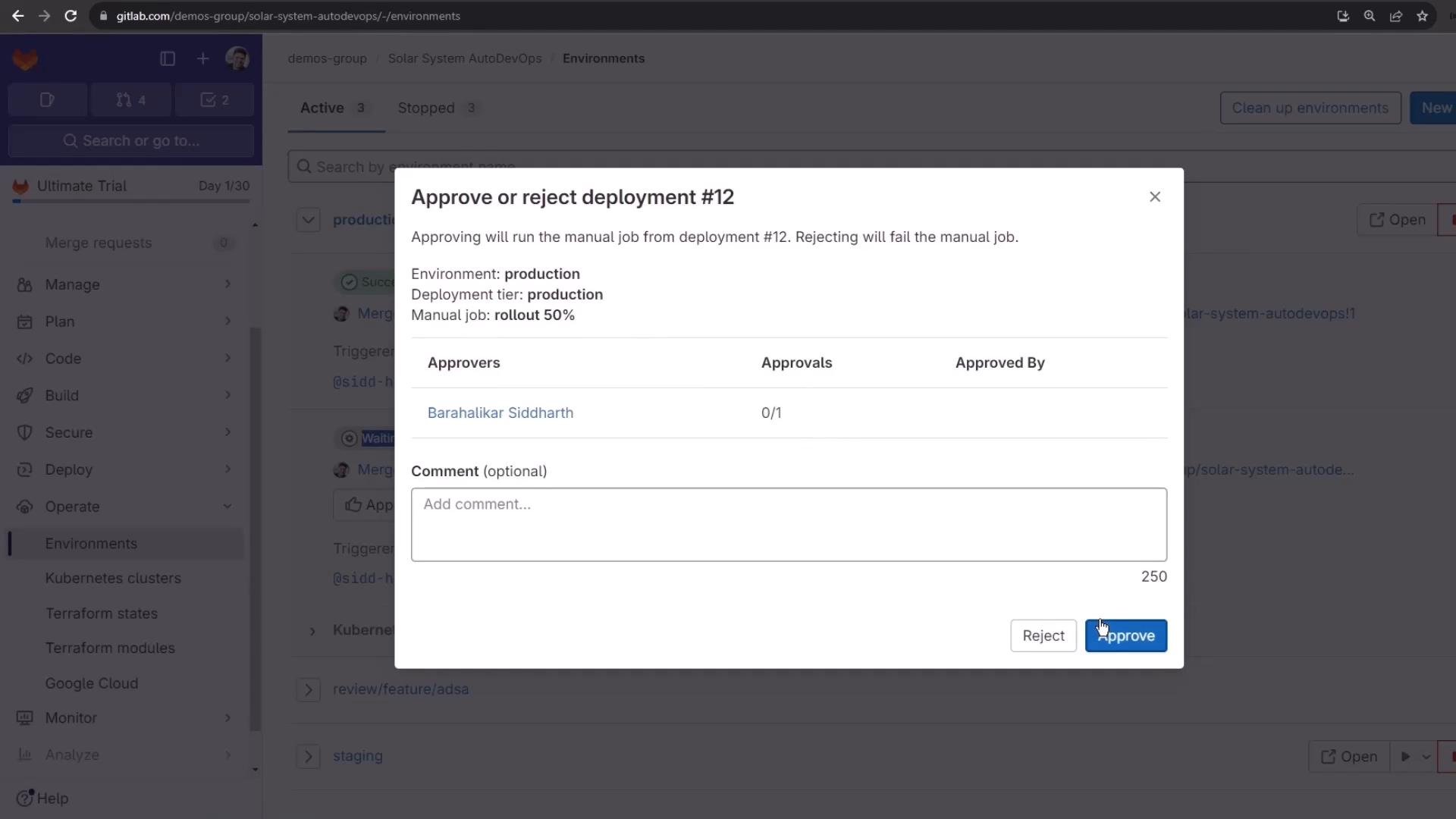 A GitLab web UI showing a modal dialog to approve or reject "deployment #12" for the production environment with fields for approvers and an optional comment. The dialog includes Reject and Approve buttons (the Approve button is highlighted).