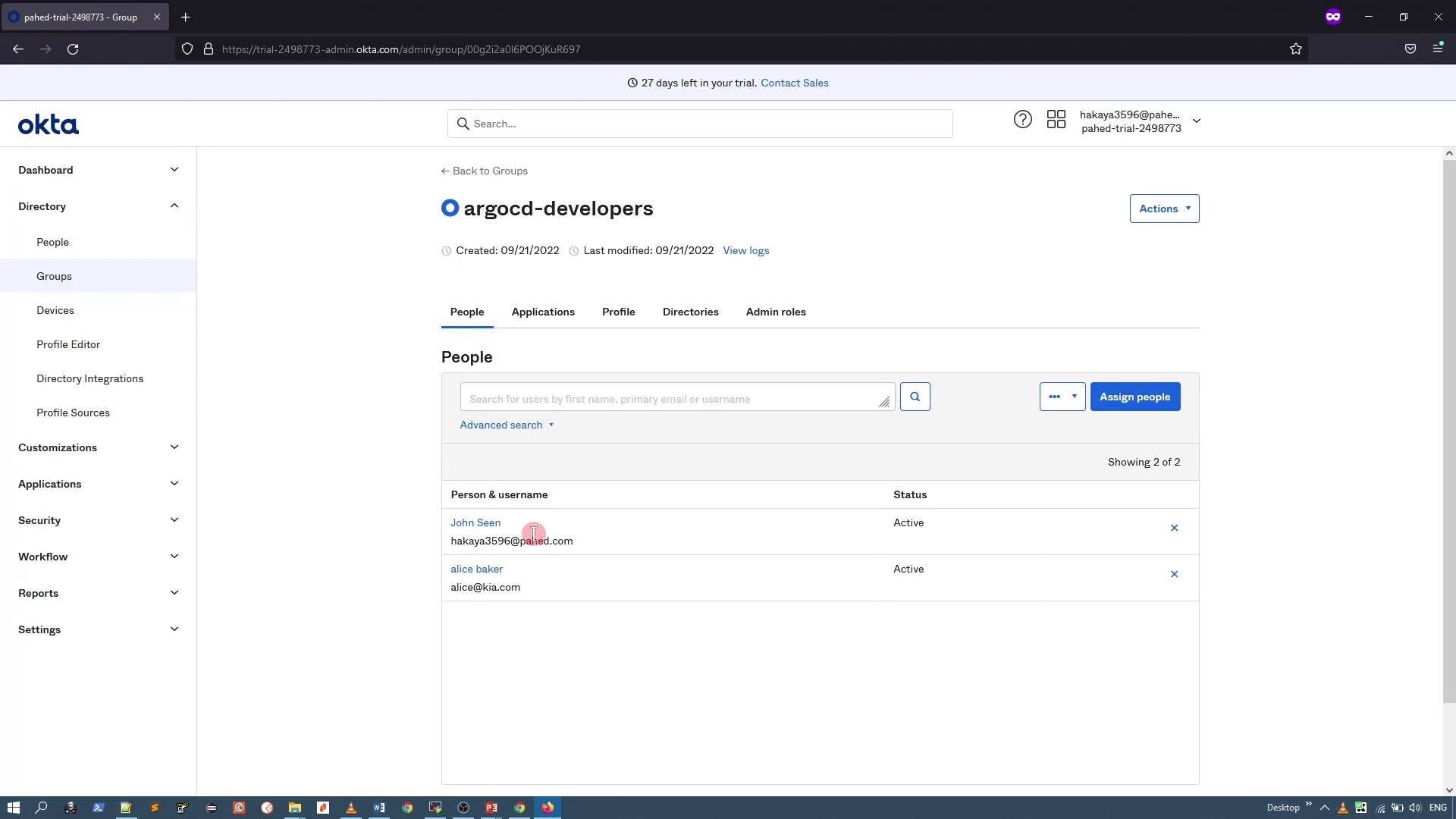 A screenshot of the Okta admin console open to the "argocd-developers" group page. The page shows a list of group members with their status and standard navigation/actions on the left and top.