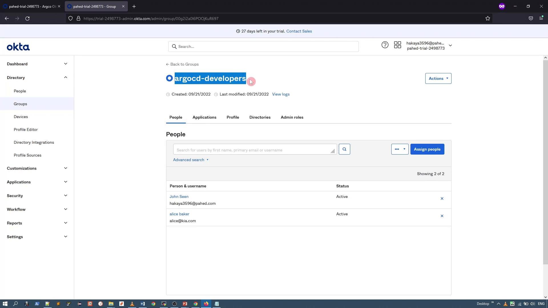 A screenshot of the Okta admin console open to a group page titled "argocd-developers." The page shows tabs (People, Applications, Profile, etc.), a list of group members with their statuses, and the left-hand navigation menu.