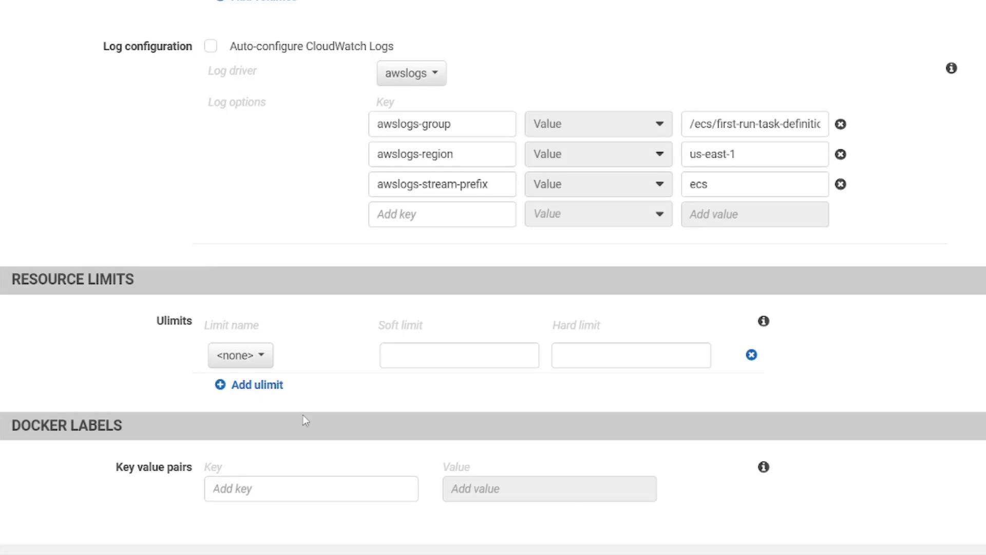 Screenshot of an AWS console task/container configuration page showing Log configuration, Resource Limits, and Docker Labels. The awslogs fields are filled (awslogs-group: /ecs/first-run-task-definition, awslogs-region: us-east-1, awslogs-stream-prefix: ecs).