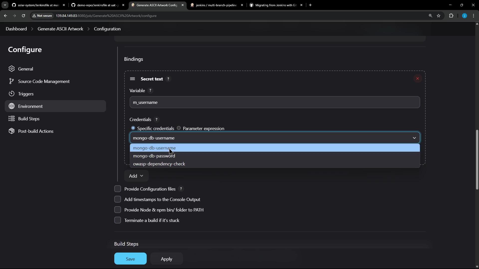 A Jenkins job "Configure" screen showing the Environment > Bindings section with a Secret text variable named "m_username" and a credentials dropdown (options include mongo-db-username, mongo-db-password, owasp-dependency-check). The Save and Apply buttons are visible at the bottom.