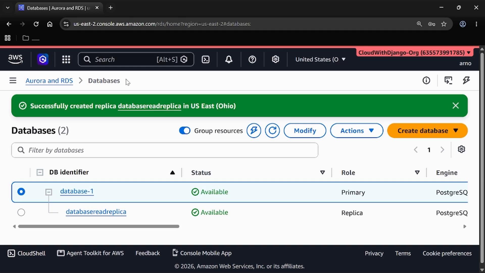 A screenshot of the AWS RDS/Aurora console showing a green notification "Successfully created replica databasereadreplica in US East (Ohio)" and a Databases list with "database-1" as Primary and "databasereadreplica" as a Replica (both Available).
