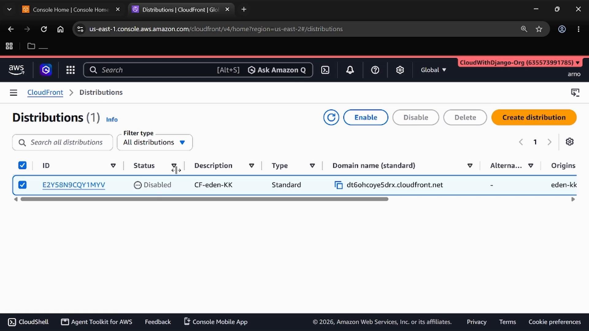 A screenshot of the AWS CloudFront Distributions console showing one distribution listed. The distribution is marked "Disabled" and displays a CloudFront domain (dt6ohcoye5drx.cloudfront.net) with controls to enable, disable, delete, or create distributions.