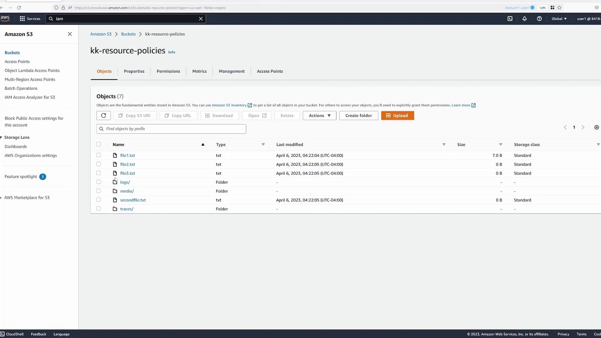 A screenshot of the Amazon S3 console showing the "kk-resource-policies" bucket with a list of objects and folders (file1.txt, file2.txt, file3.txt, logs/, media/, secondfile.txt, traces/). The UI shows toolbar actions like Upload, Create folder, and object details (type, last modified, size).