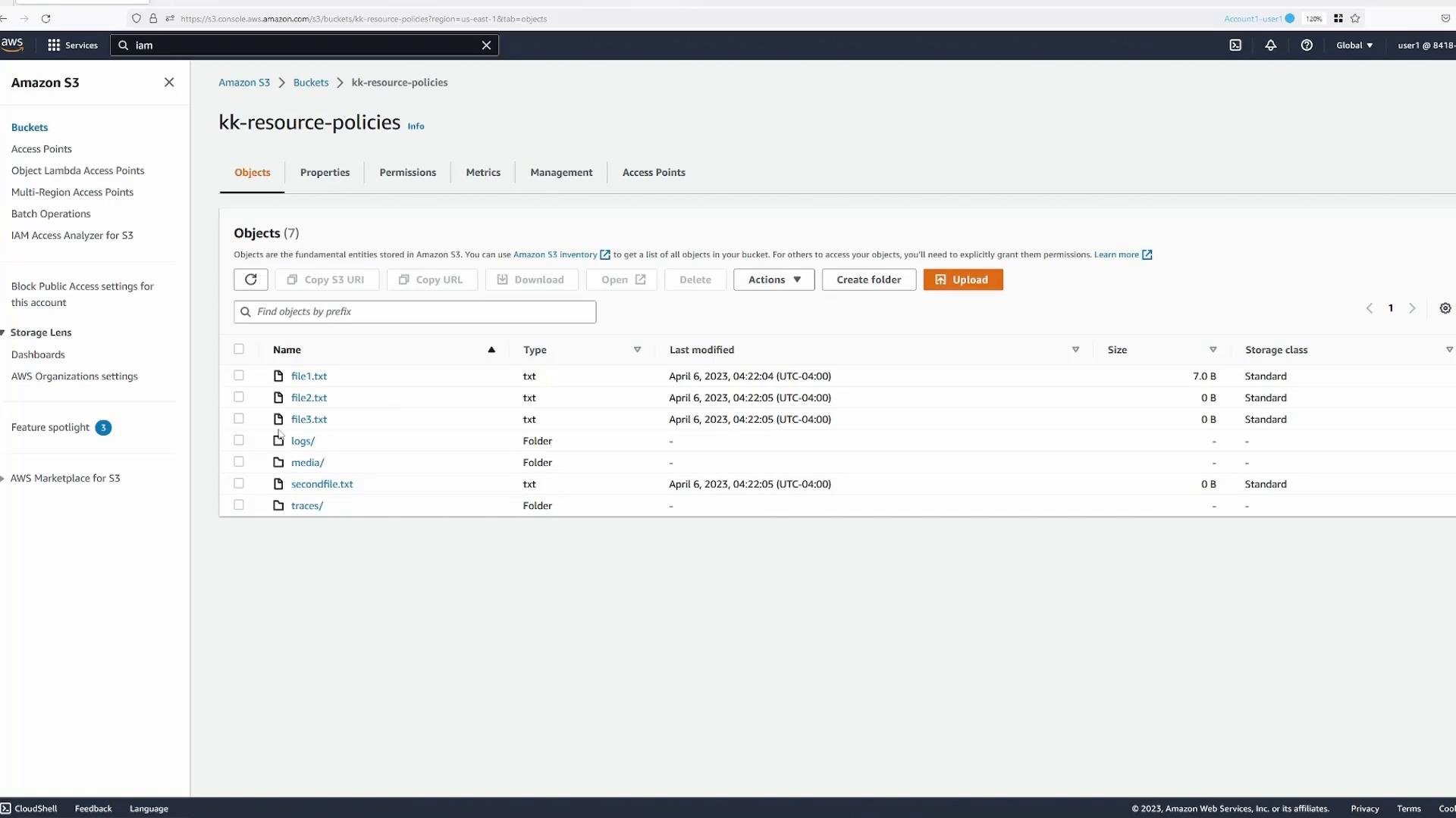 A screenshot of the Amazon S3 console showing the "kk-resource-policies" bucket with a list of objects and folders (file1.txt, file2.txt, file3.txt, logs/, media/, secondfile.txt, traces/). The UI shows toolbar actions like Upload, Create folder, and object details (type, last modified, size).