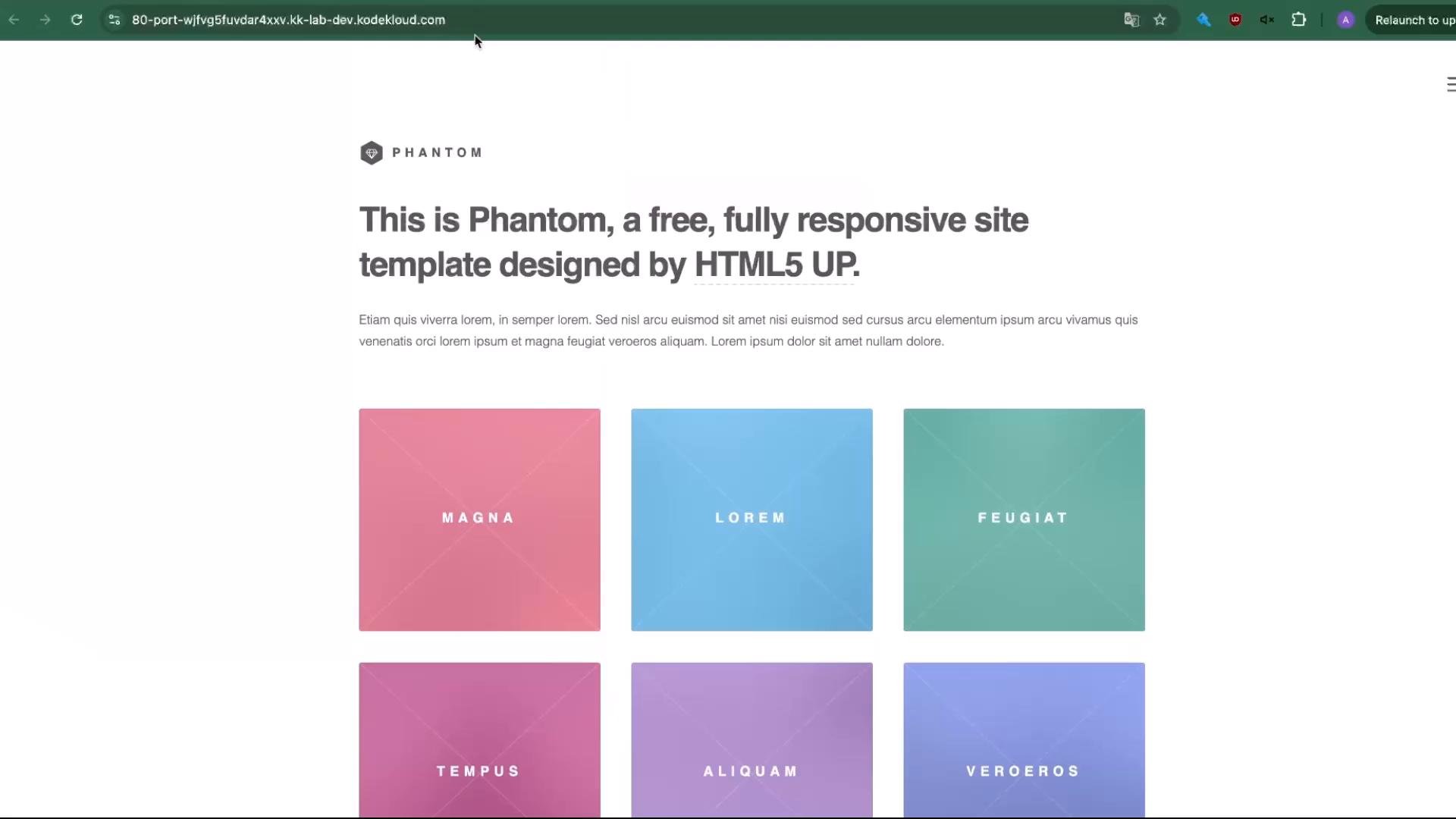A screenshot of a minimalist webpage template titled "Phantom" with a large headline and a short paragraph of placeholder text. Below the header is a grid of colorful square feature cards labeled with words like "MAGNA", "LOREM", and "FEUGIAT".