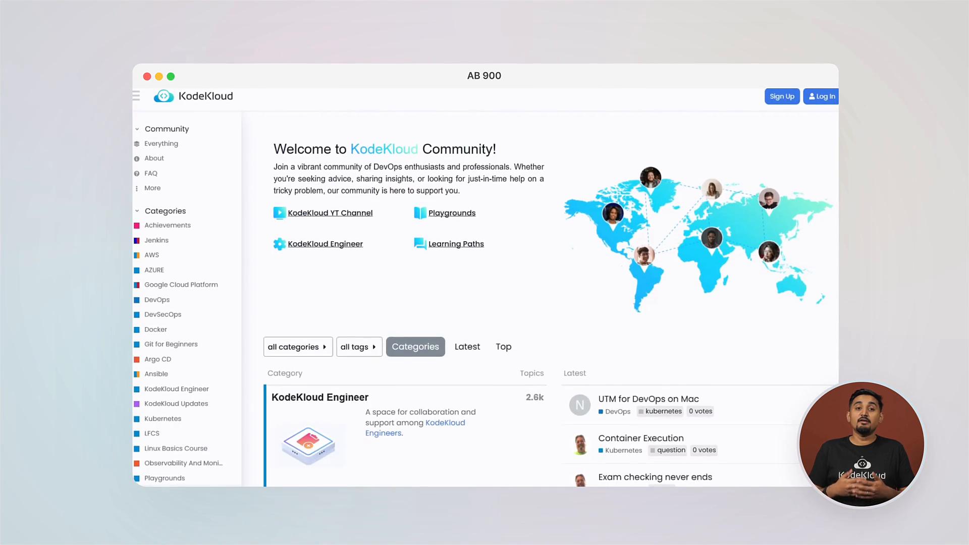 A screenshot of the KodeKloud community webpage showing a left-hand category menu, a welcome message with a world map and user avatars, and forum topic listings. A small circular video overlay of a presenter appears in the bottom-right.