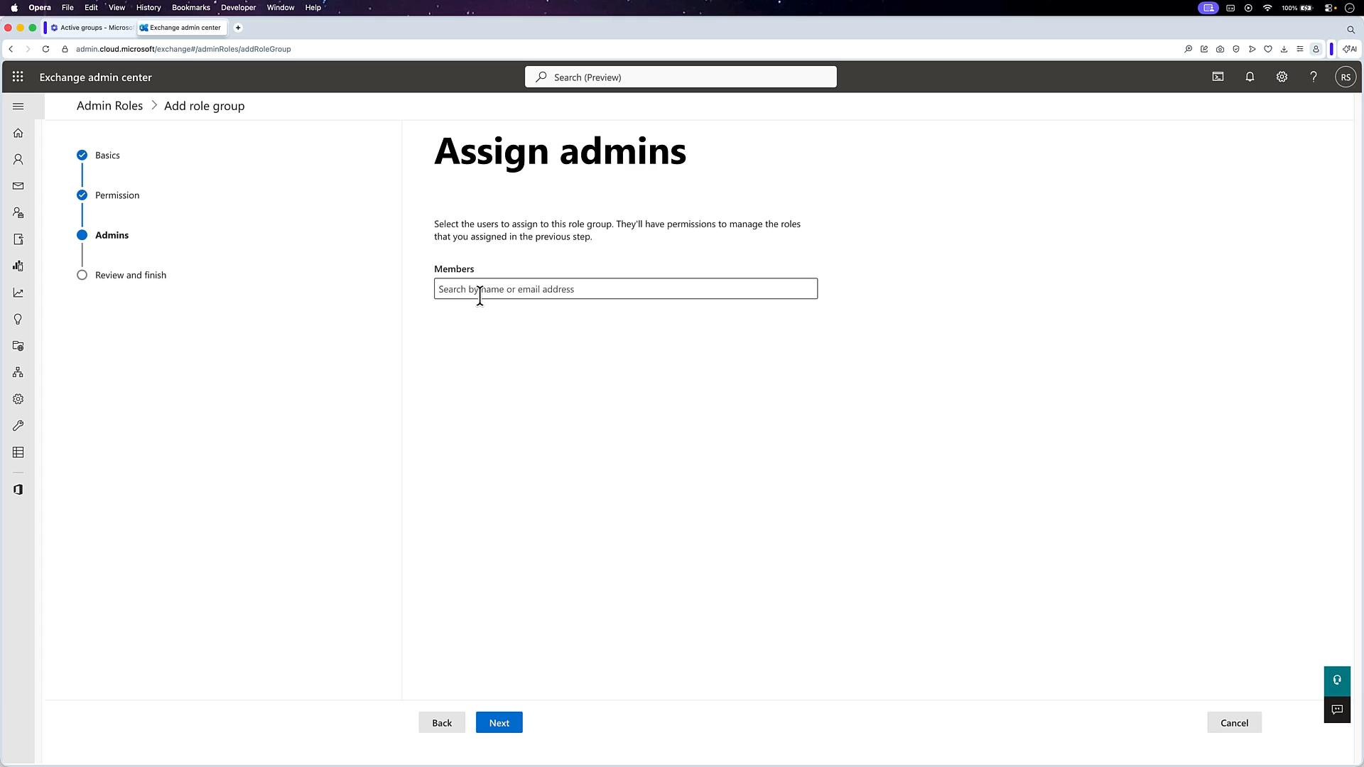Screenshot of the Exchange admin center showing the "Assign admins" page with a search box to add members to a role group. The left pane shows the setup steps (Basics, Permission, Admins, Review and finish) and there are Back/Next buttons at the bottom.
