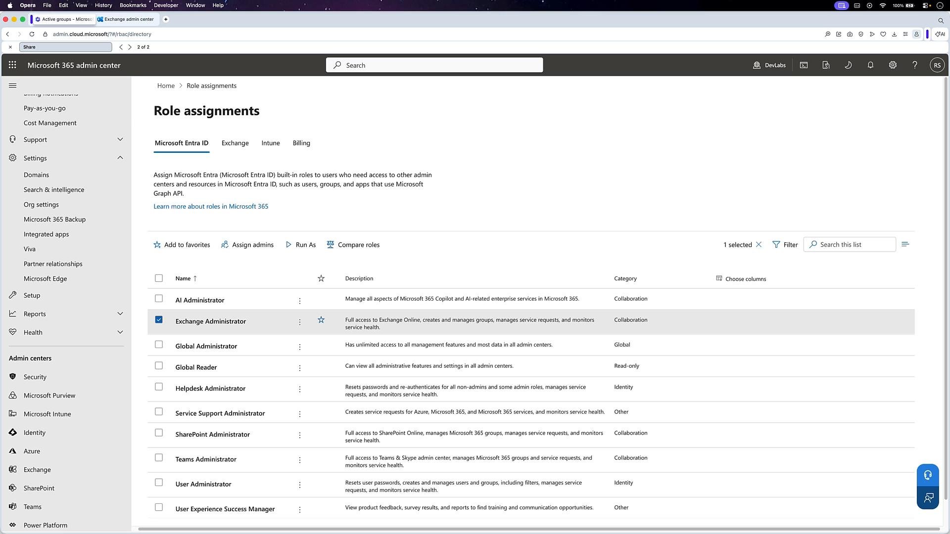 A screenshot of the Microsoft 365 admin center open to the "Role assignments" page, showing a list of built-in admin roles (with "Exchange Administrator" selected) and brief role descriptions. The left navigation menu and top search bar are also visible.