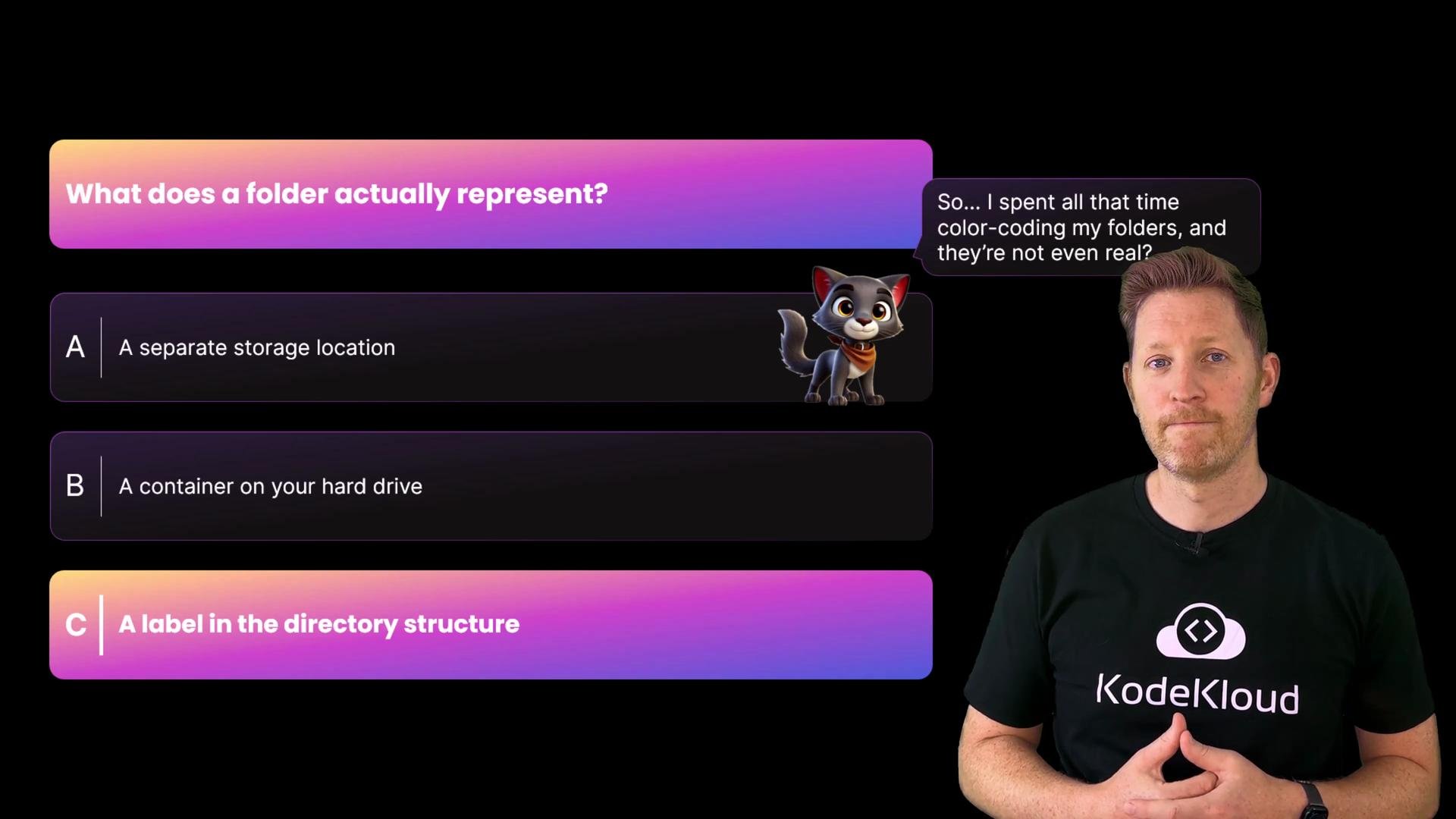 A presenter stands beside a colorful quiz slide titled "What does a folder actually represent?" showing multiple-choice answers and a cartoon cat with a speech bubble about color‑coding folders. The presenter is wearing a KodeKloud shirt.