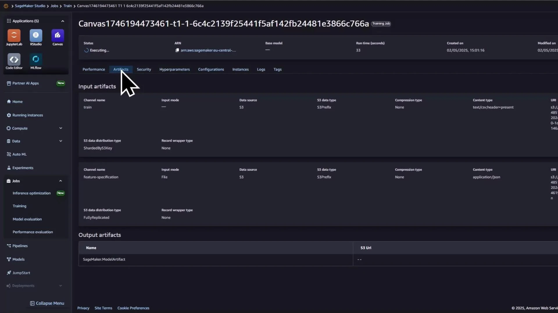 A dark-themed AWS SageMaker Studio screenshot showing a training job details page (Artifacts tab selected) for a Canvas job. The main panel lists input artifacts (channels like "train" and "feature-specification") and an output artifacts section, with the left navigation menu visible.