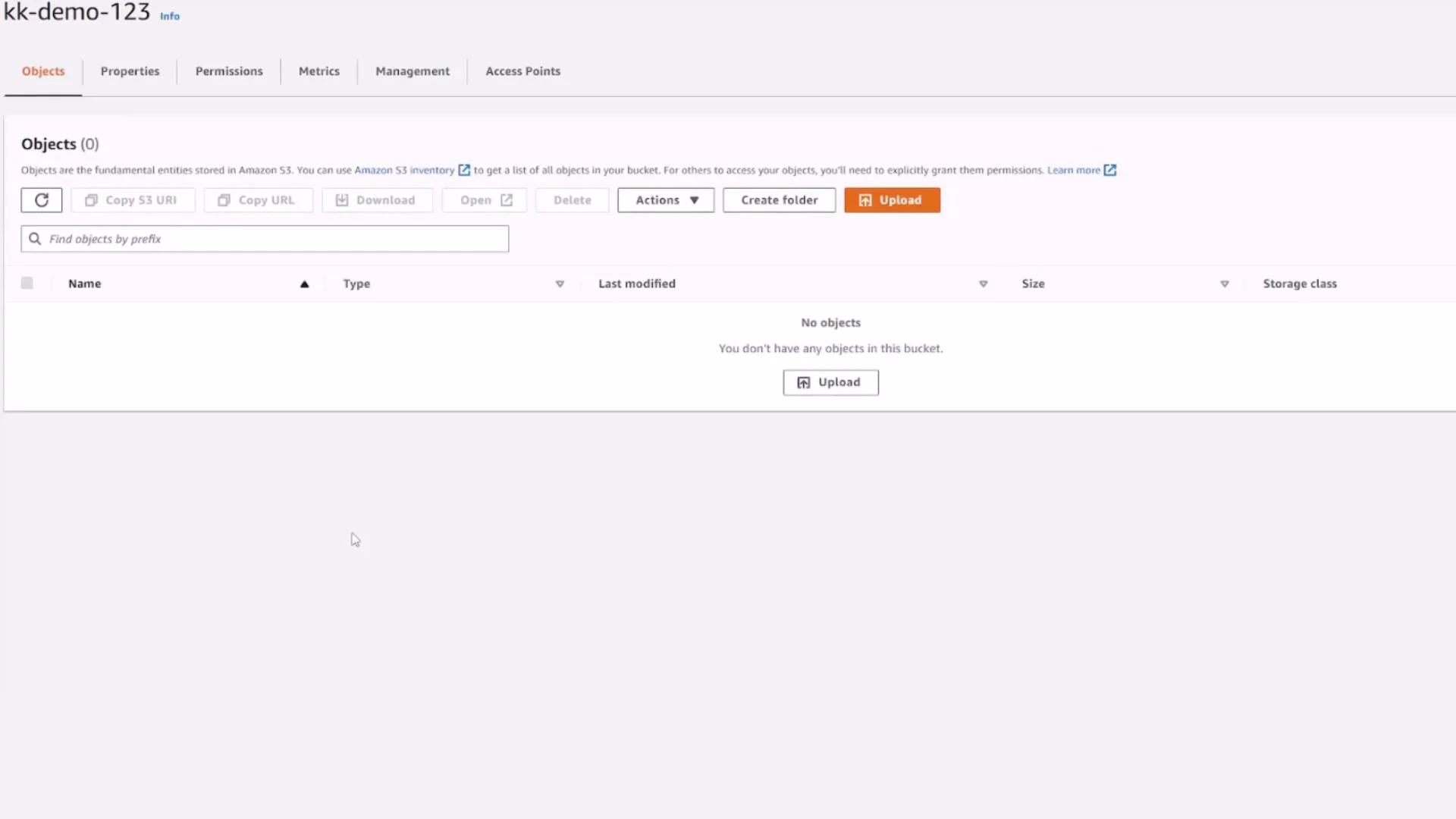 A screenshot of the Amazon S3 console for bucket "kk-demo-123" showing the Objects tab with no objects listed and an "Upload" button.