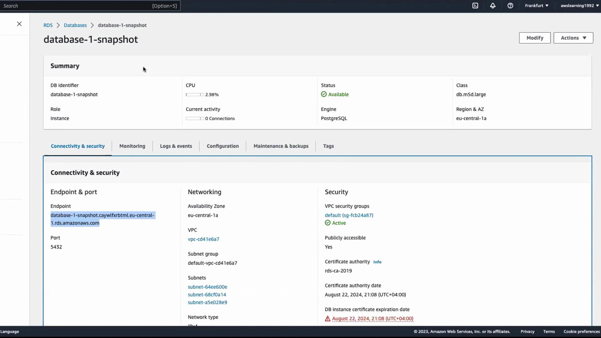 A screenshot of the AWS RDS console showing the "database-1-snapshot" PostgreSQL DB snapshot summary and status. The Connectivity & Security panel (highlighted) shows the endpoint, port 5432, VPC/subnets, and security group details.