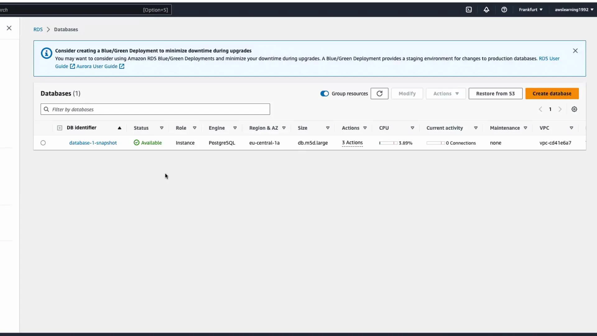 A screenshot of the AWS RDS Databases console showing one PostgreSQL instance named "database-1-snapshot" with status "Available." The row shows instance details like role (Instance), region eu-central-1a, and size db.m5d.large.