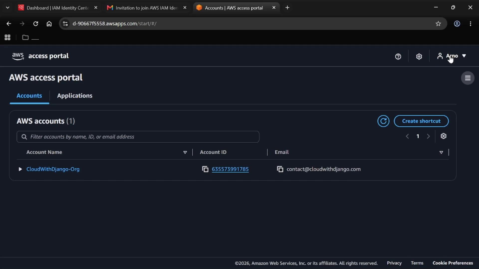 A screenshot of the AWS Access Portal showing the "Accounts" tab with one listed account named "CloudWithDjango-Org," its account ID, and an email contact. The page includes a search/filter bar and a "Create shortcut" button.