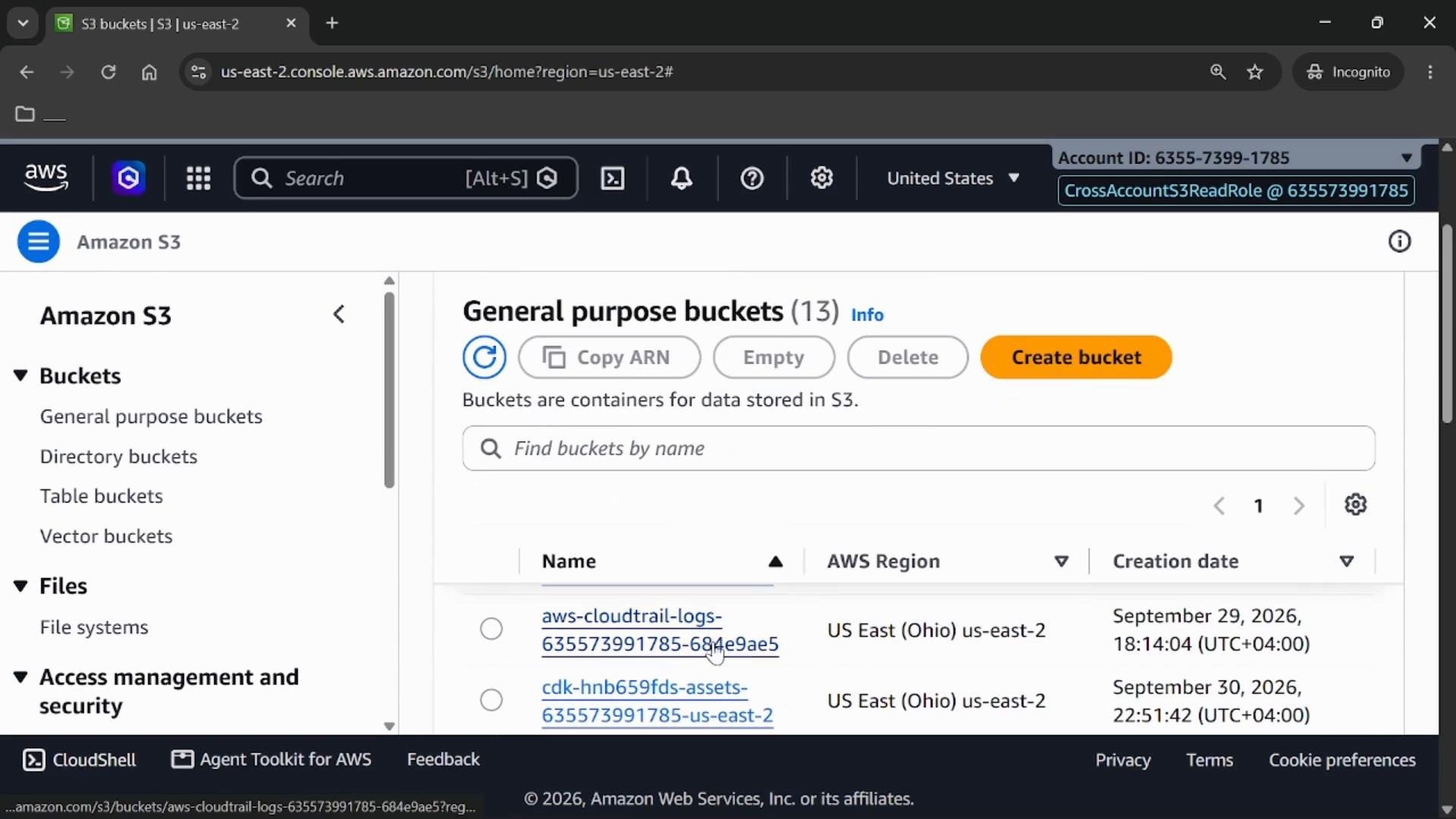 A screenshot of the Amazon S3 web console showing the "General purpose buckets" view with a list of S3 bucket names, their AWS region and creation dates. The top bar shows actions like Copy ARN, Empty, Delete and an orange "Create bucket" button.