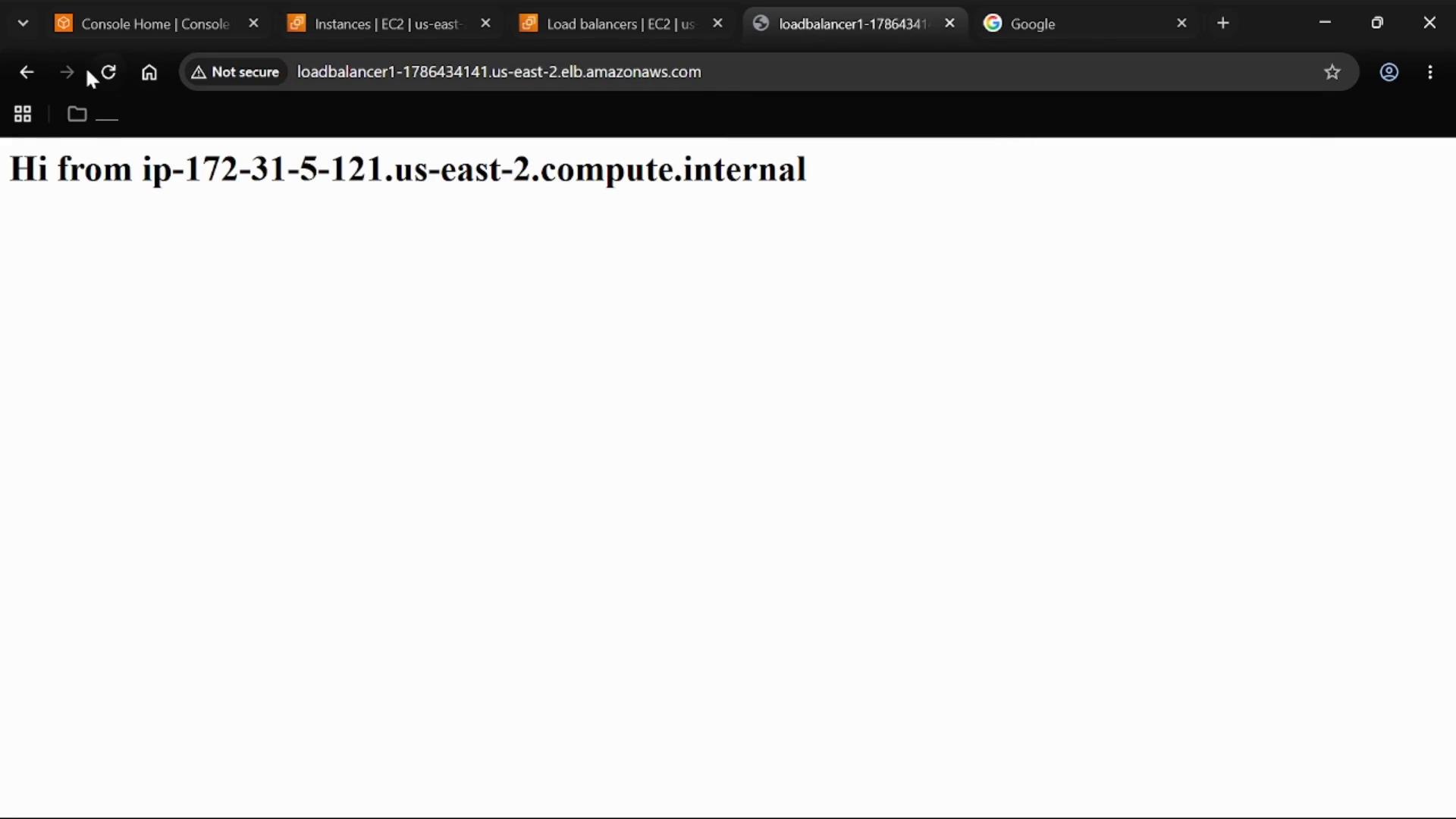 A browser screenshot showing a simple web page that reads "Hi from ip-172-31-5-121.us-east-2.compute.internal." The address bar shows an AWS load balancer hostname and the connection is marked "Not secure."