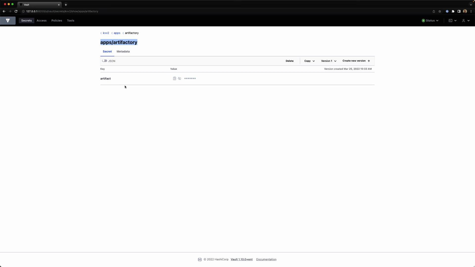 A screenshot of the HashiCorp Vault web UI showing the secret at path "apps/artifactory" with a single key "artifact" whose value is masked. The page is served locally (127.0.0.1:8200) and shows version metadata from Mar 25, 2022.