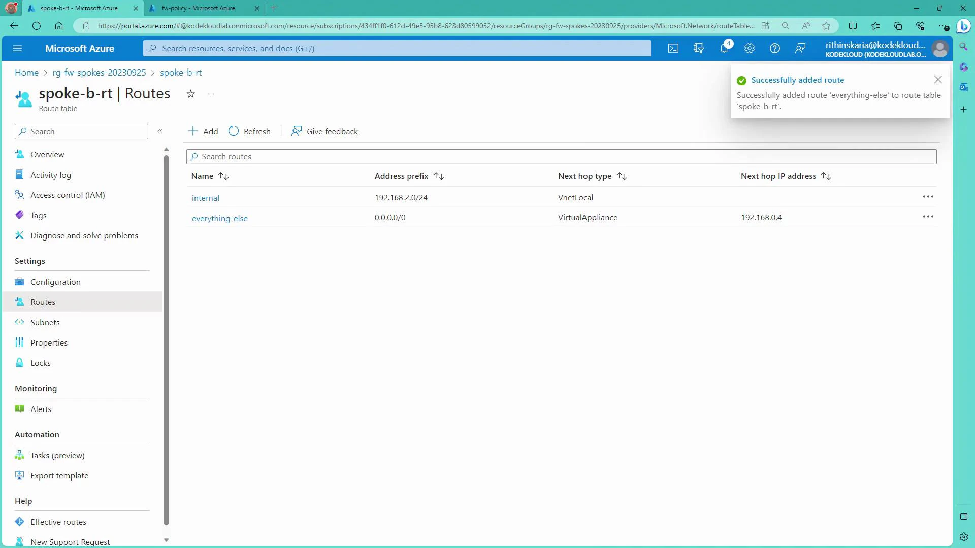 A Microsoft Azure portal screenshot showing the "spoke-b-rt" route table with two routes: "internal" (192.168.2.0/24 via VnetLocal) and "everything-else" (0.0.0.0/0 via VirtualAppliance to 192.168.0.4). A notification at the top-right confirms the "everything-else" route was successfully added.