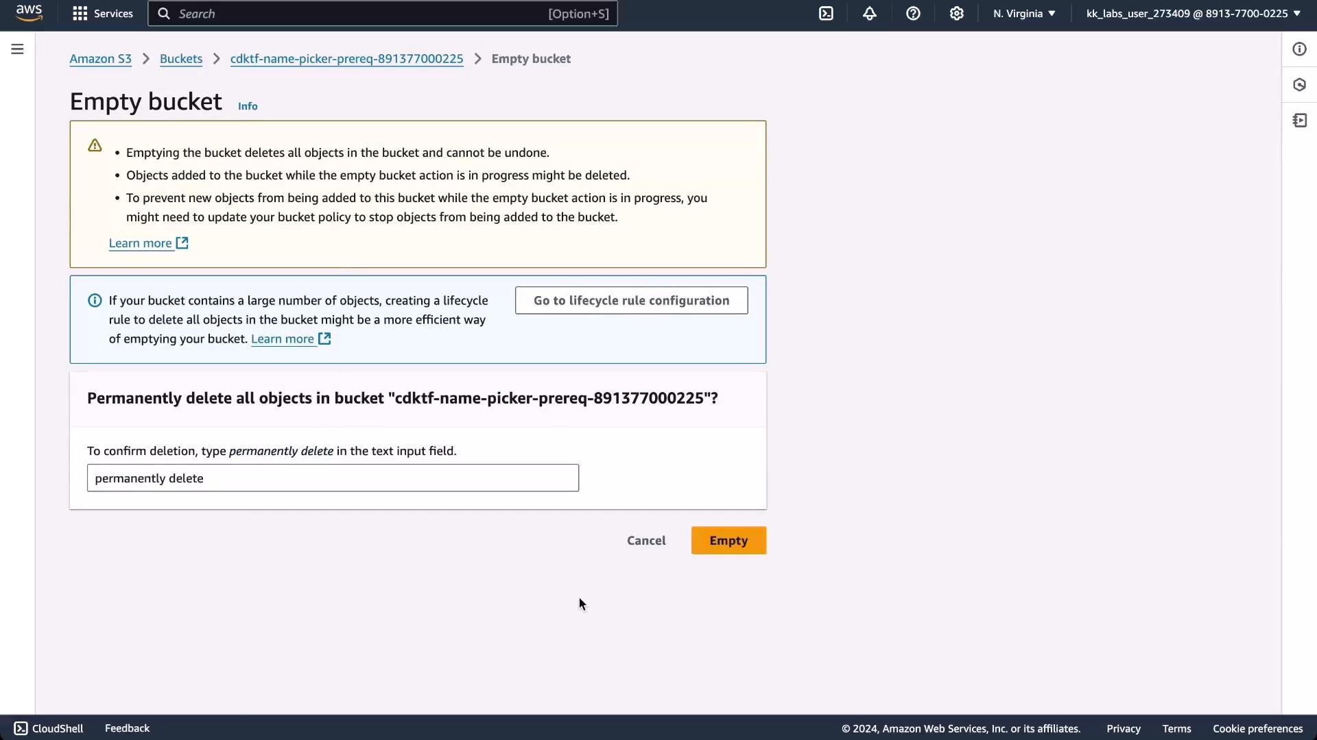 A screenshot of the Amazon S3 console showing an "Empty bucket" confirmation page. It displays warnings, a textbox requiring you to type "permanently delete," and an orange "Empty" button to confirm deletion.