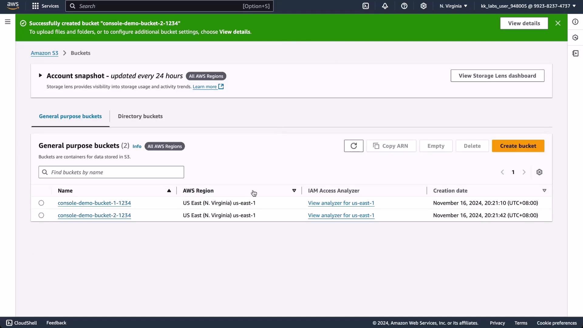 A screenshot of the AWS S3 console with a green success banner confirming creation of "console-demo-bucket-2-1234." The General purpose buckets list shows two buckets (console-demo-bucket-1-1234 and console-demo-bucket-2-1234) in the US East (N. Virginia) region.