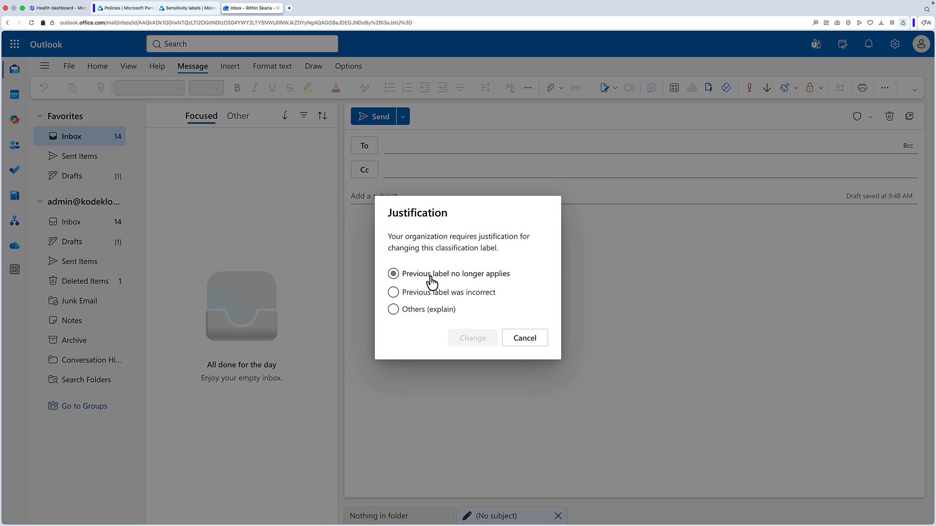 A screenshot of the Outlook web mail interface showing an open compose window and the inbox sidebar. A modal dialog titled "Justification" prompts the user to select a reason for changing a classification label (e.g., "Previous label no longer applies").