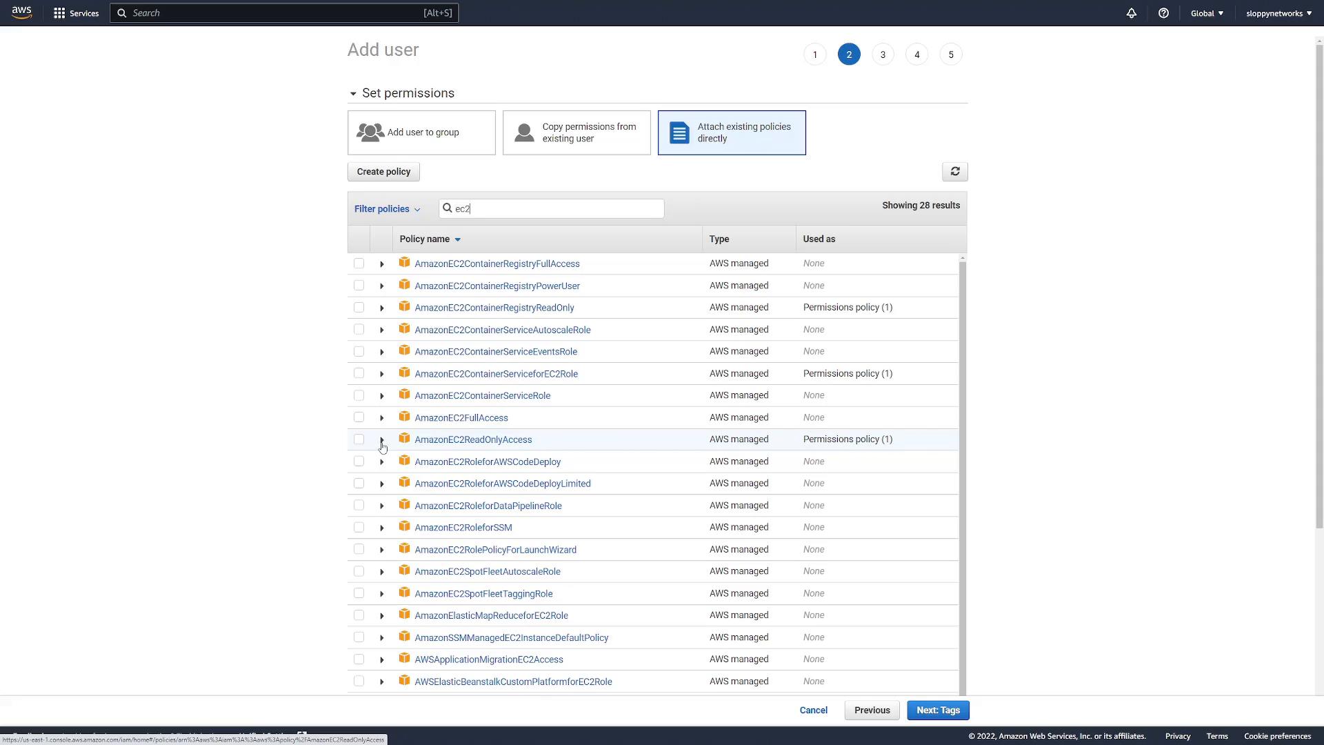 A screenshot of the AWS IAM "Add user" permissions screen with "Attach existing policies directly" selected and a search filter for "ec2", showing a scrollable list of AWS-managed EC2 policies (e.g., AmazonEC2ReadOnlyAccess) with checkboxes. Navigation buttons like "Previous" and "Next: Tags" are visible at the bottom.