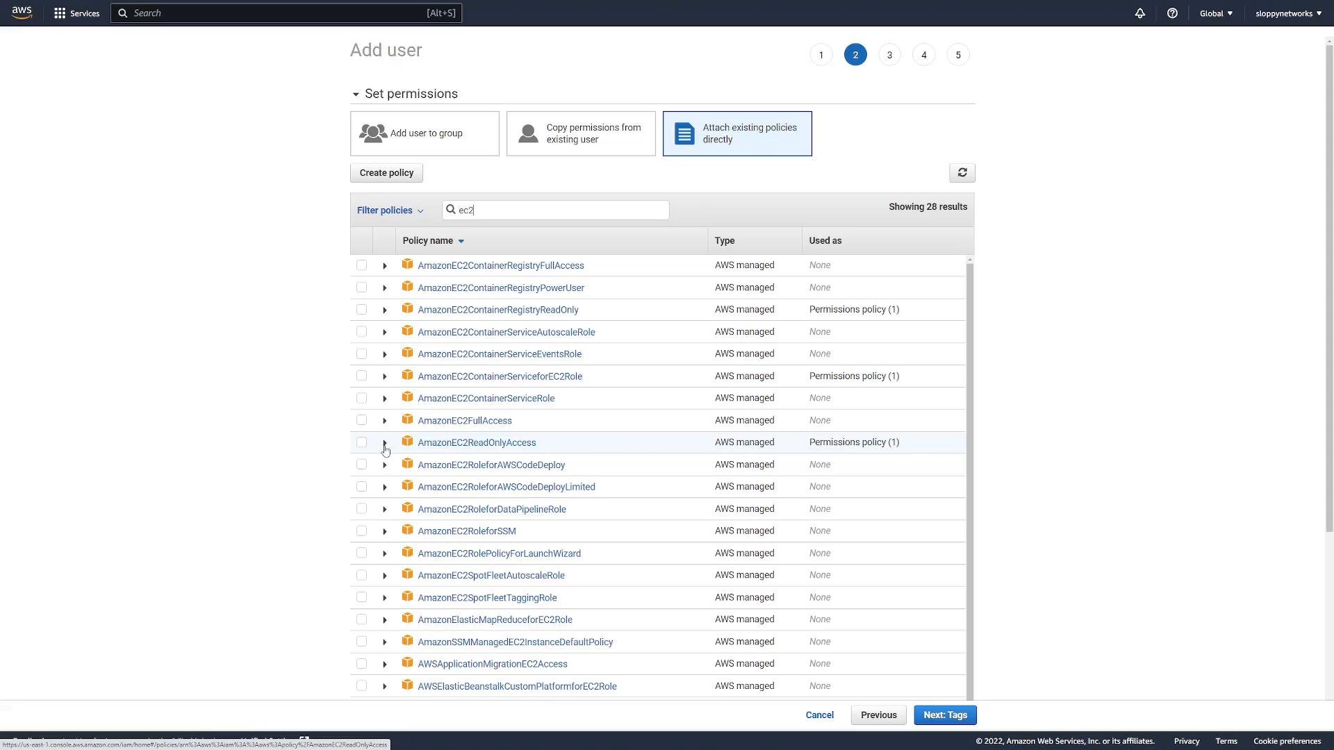 A screenshot of the AWS IAM "Add user" permissions screen with "Attach existing policies directly" selected and a search filter for "ec2", showing a scrollable list of AWS-managed EC2 policies (e.g., AmazonEC2ReadOnlyAccess) with checkboxes. Navigation buttons like "Previous" and "Next: Tags" are visible at the bottom.