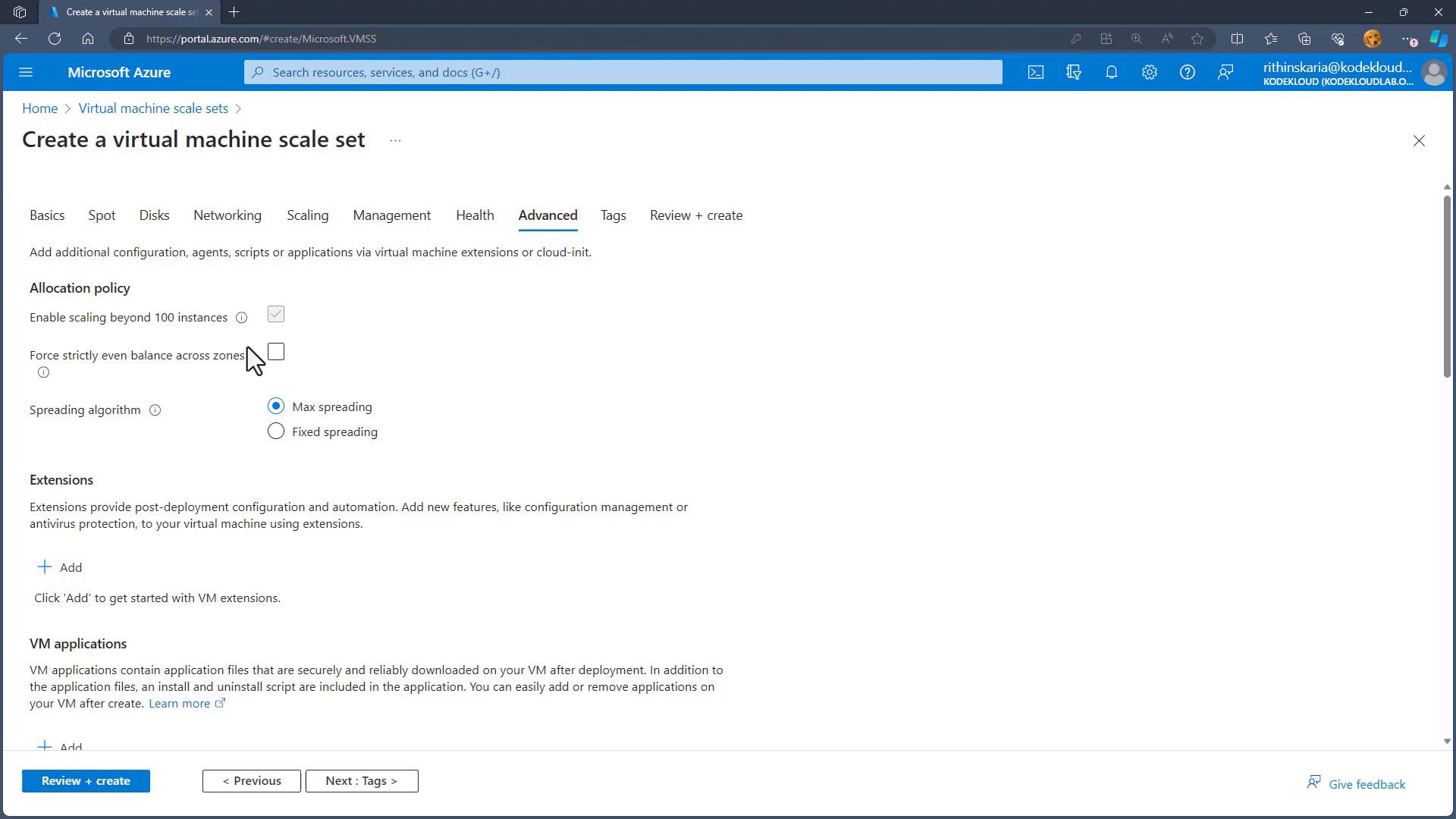 A screenshot of the Microsoft Azure portal showing the "Create a virtual machine scale set" page (Advanced tab). It displays allocation policy options (enable scaling beyond 100 instances, spreading algorithm), sections for extensions and VM applications, and navigation buttons like "Review + create."