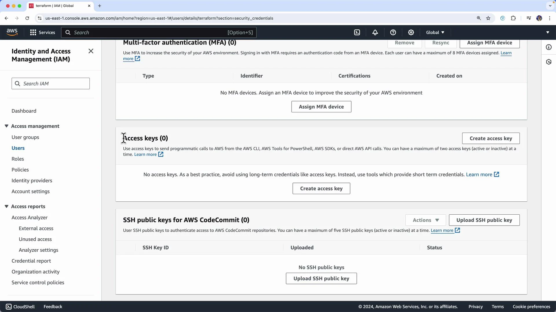 The image shows the AWS Identity and Access Management (IAM) dashboard focused on security credentials, including options for multi-factor authentication, access keys, and SSH public keys.