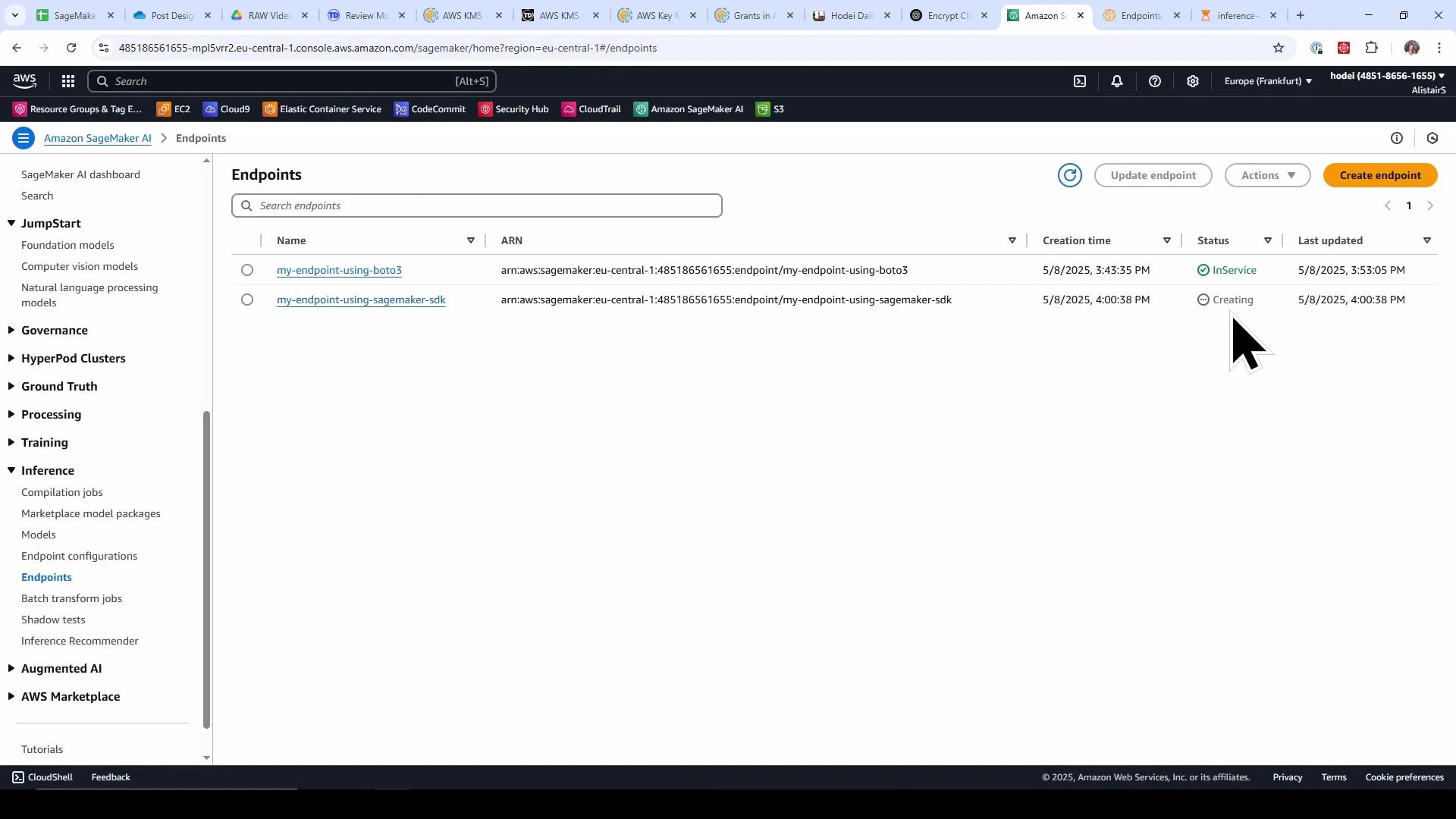 A screenshot of the Amazon SageMaker "Endpoints" console showing two endpoints named "my-endpoint-using-boto3" and "my-endpoint-using-sagemaker-sdk." The first endpoint is marked InService and the second is marked Creating, with a large mouse pointer visible.
