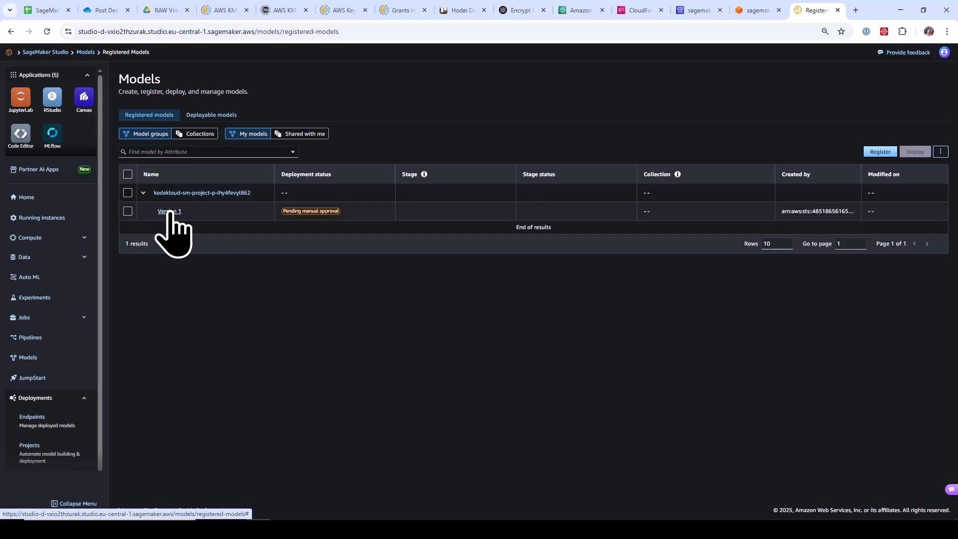 Screenshot of the AWS SageMaker Studio "Models" page showing a registered model (kodekloud-sm-project-...) with a "Pending manual approval" deployment status. The left navigation pane and a hand-cursor icon pointing at the model entry are also visible.