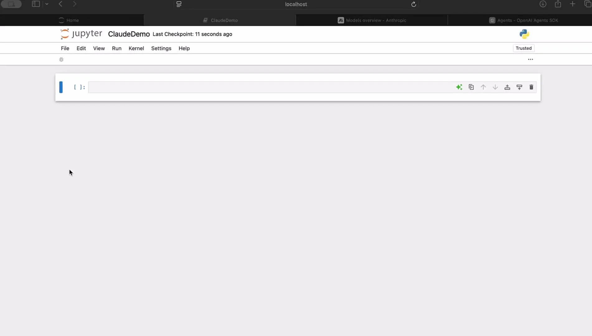 The image shows a Jupyter Notebook interface with an empty code cell and a "ClaudeDemo" file open.