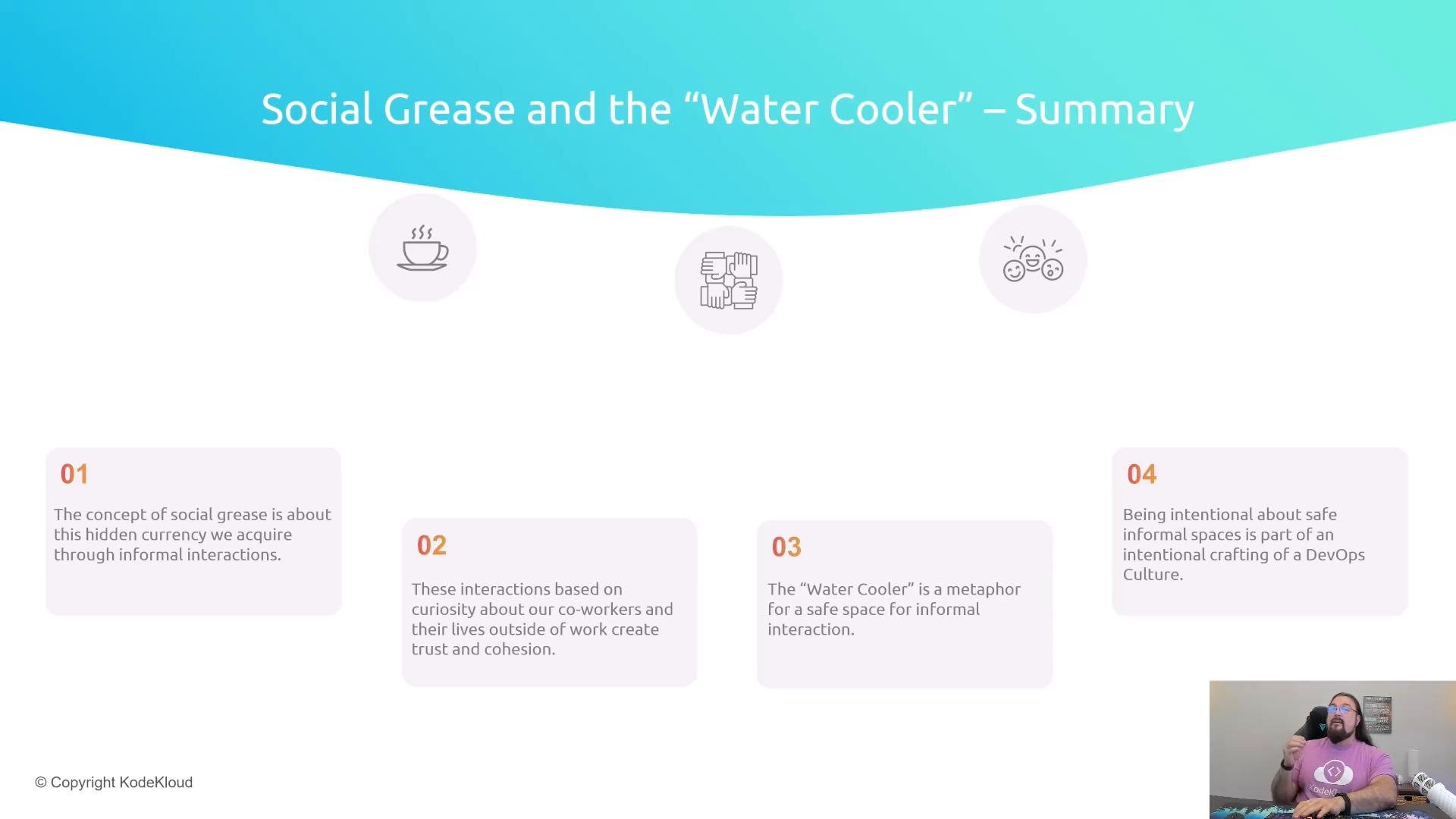 A presentation slide titled "Social Grease and the 'Water Cooler' – Summary" showing icons and four numbered summary boxes about informal workplace interactions. A small webcam inset in the bottom-right shows a bearded man in a pink shirt speaking.