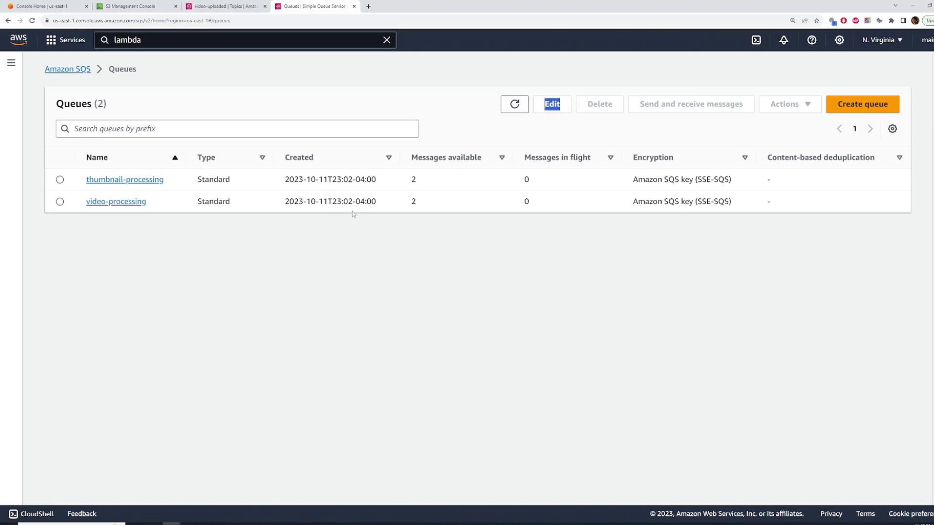A screenshot of the AWS SQS Queues page showing two queues named "thumbnail-processing" and "video-processing." Both are Standard queues with 2 messages available and 0 messages in flight.