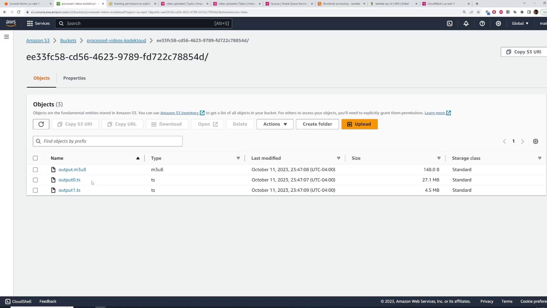 A screenshot of the Amazon S3 console showing a folder (ee33fc58-...) with the Objects tab open. Three files are listed — output.m3u8, output0.ts, and output1.ts — with their sizes and last-modified timestamps.