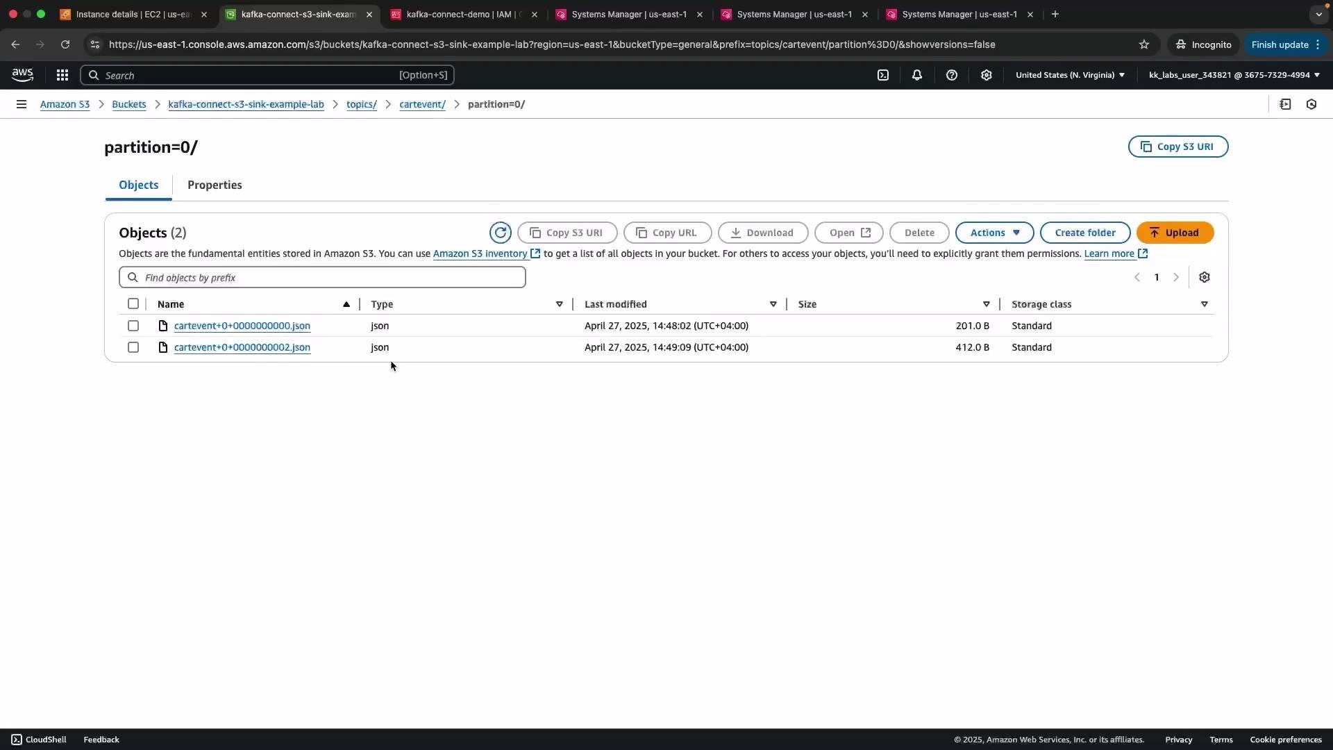 The image shows an Amazon S3 console with two JSON files listed under the "cartevent" folder in the "kafka-connect-s3-sink-example-lab" bucket. The files are named "cartevent+0+0000000000.json" and "cartevent+0+0000000002.json".